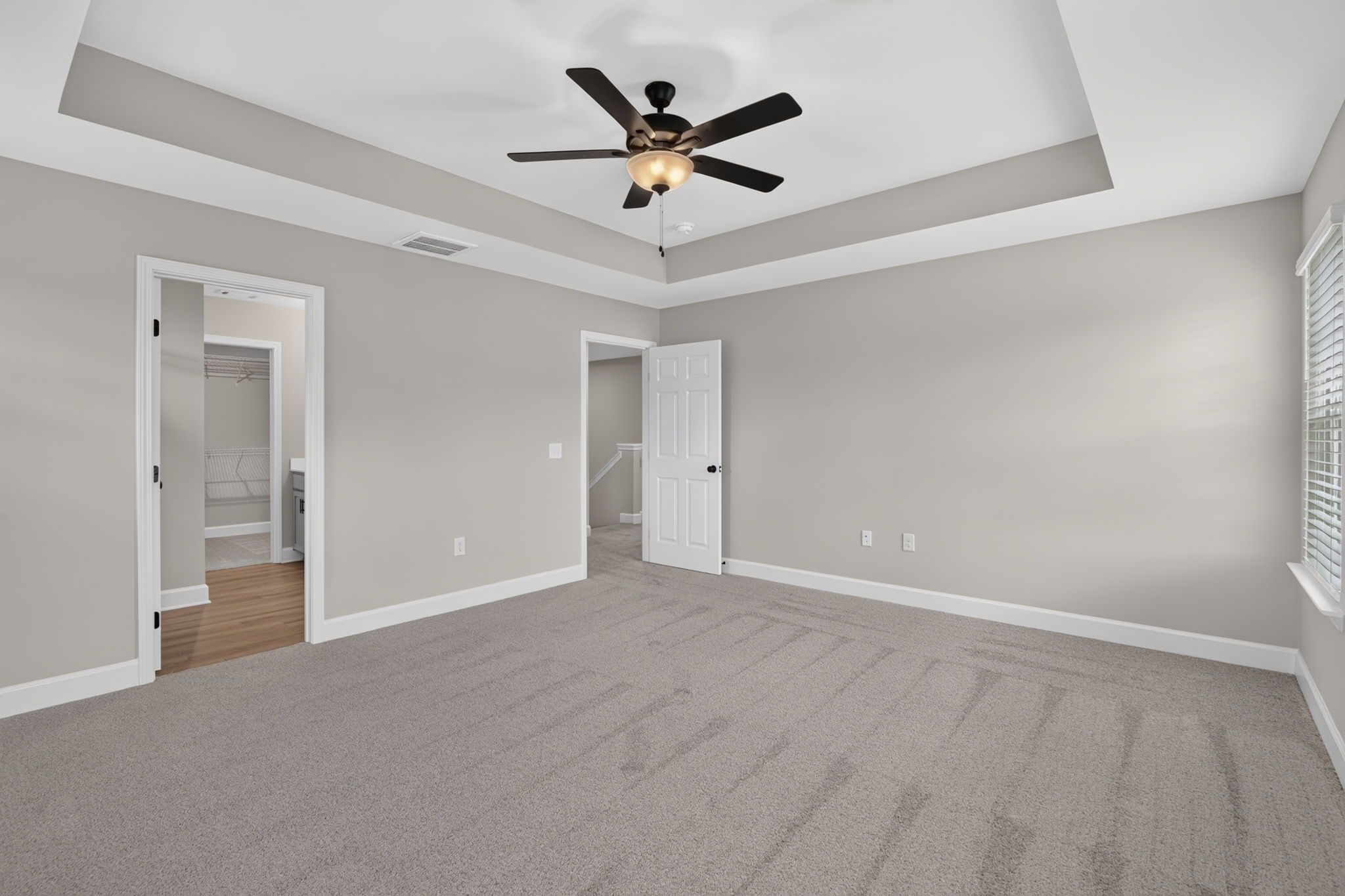 Primary Bedroom View Toward En Suite Bath & Walk-In Closet at 245 James Drive – Dunham Marsh