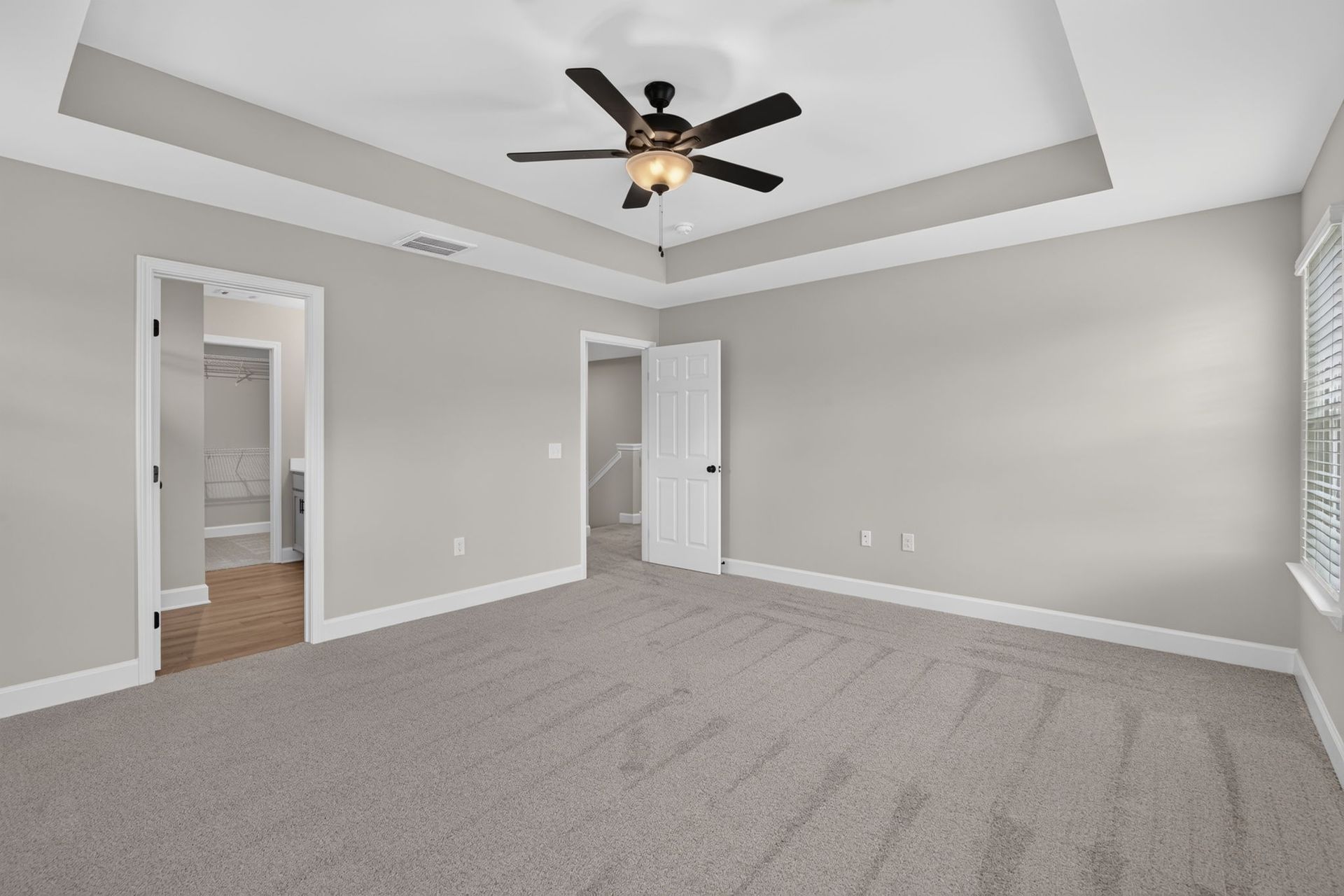 Primary Bedroom View Toward En Suite Bath & Walk-In Closet at 245 James Drive – Dunham Marsh