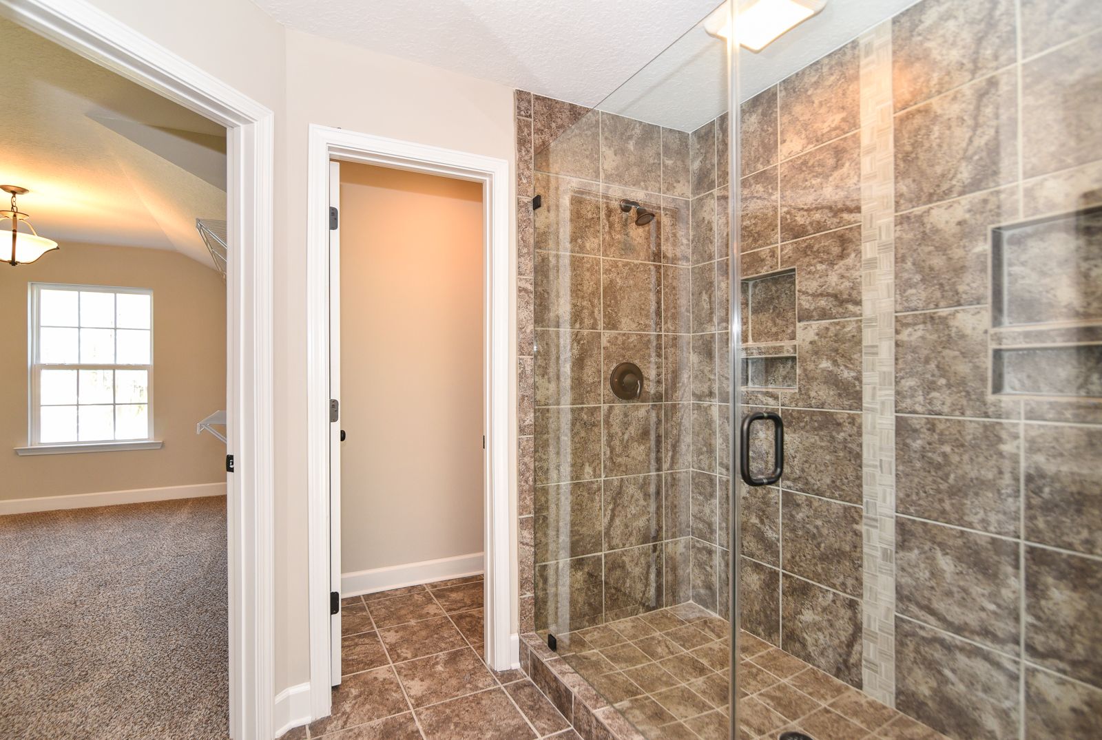 Hilton - Owner's Suite Tile Shower | Ernest Homes