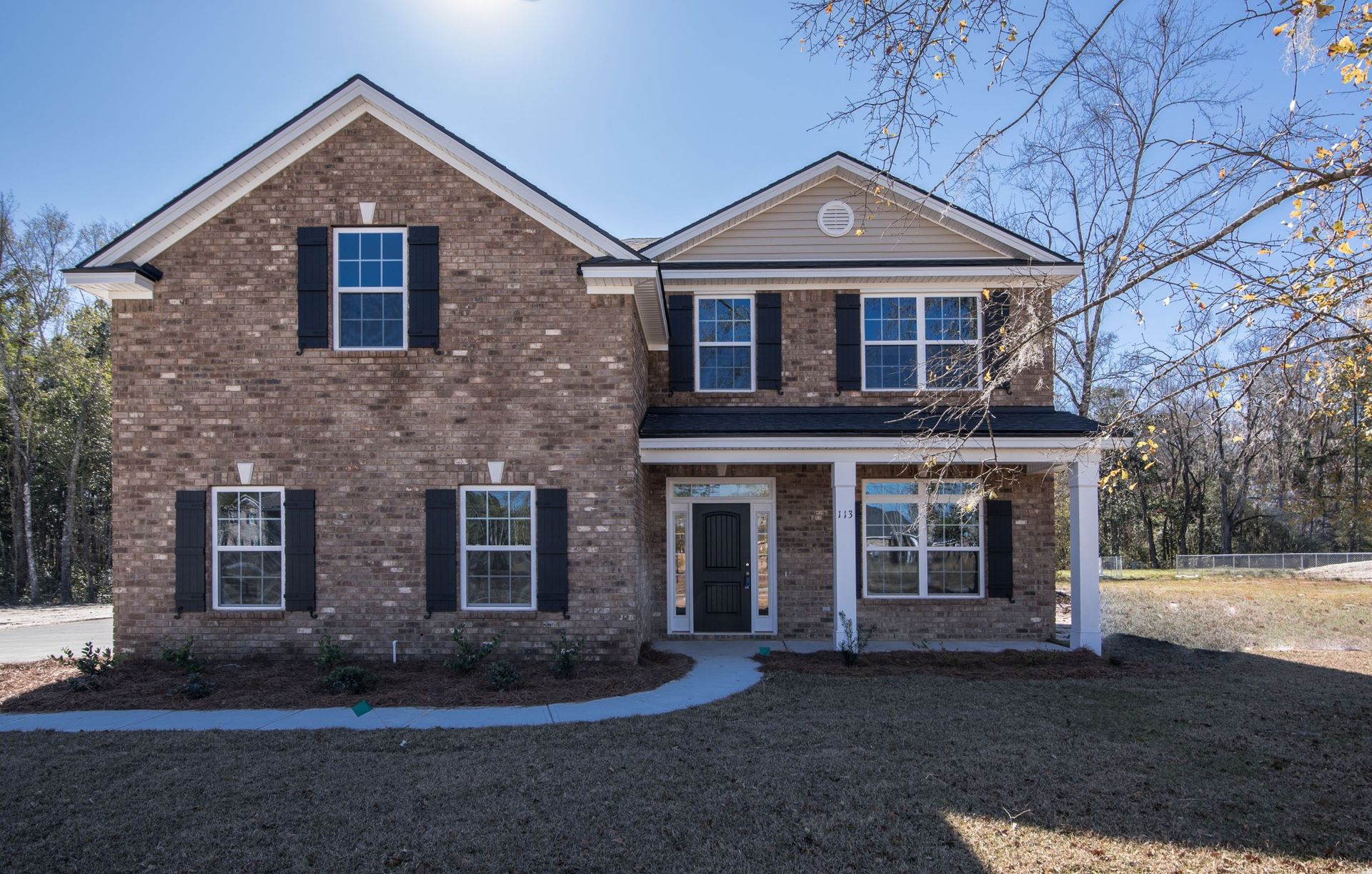 Nantucket - Elevation E with four side brick and side entry garage | Ernest Homes