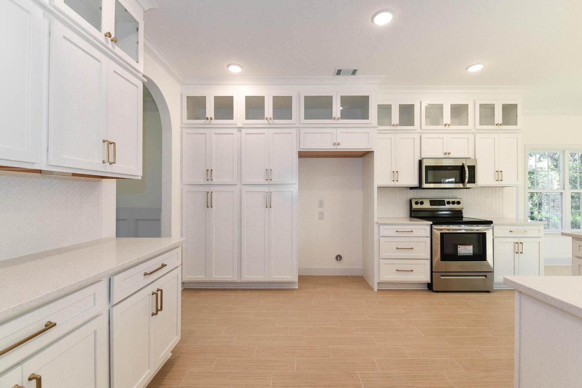 Hilton Kitchen With Stacked Cabinets and Glass Doors  | Ernest Homes