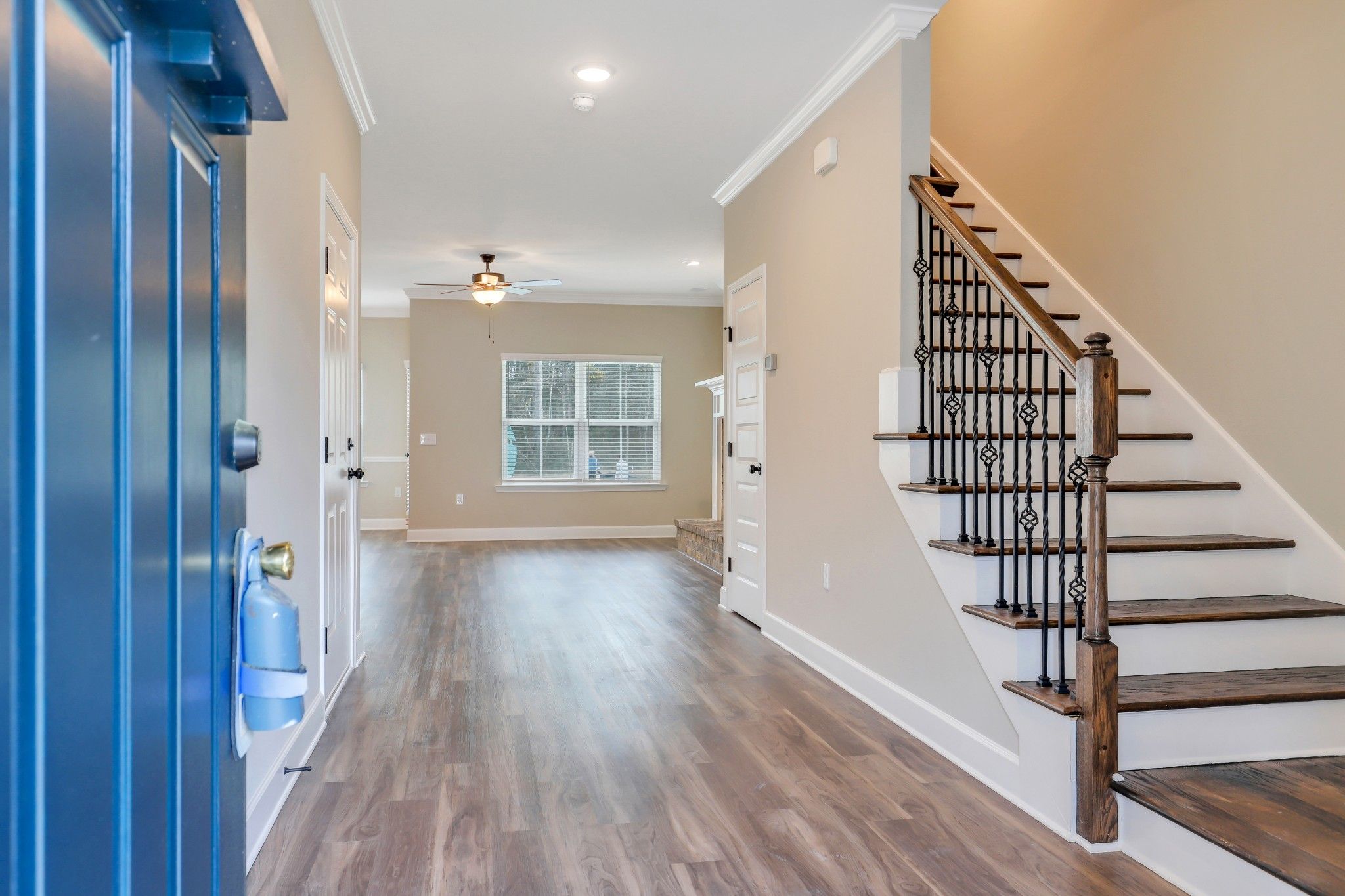Seabrook - Foyer and optional oak & iron stair railing  | Ernest Homes