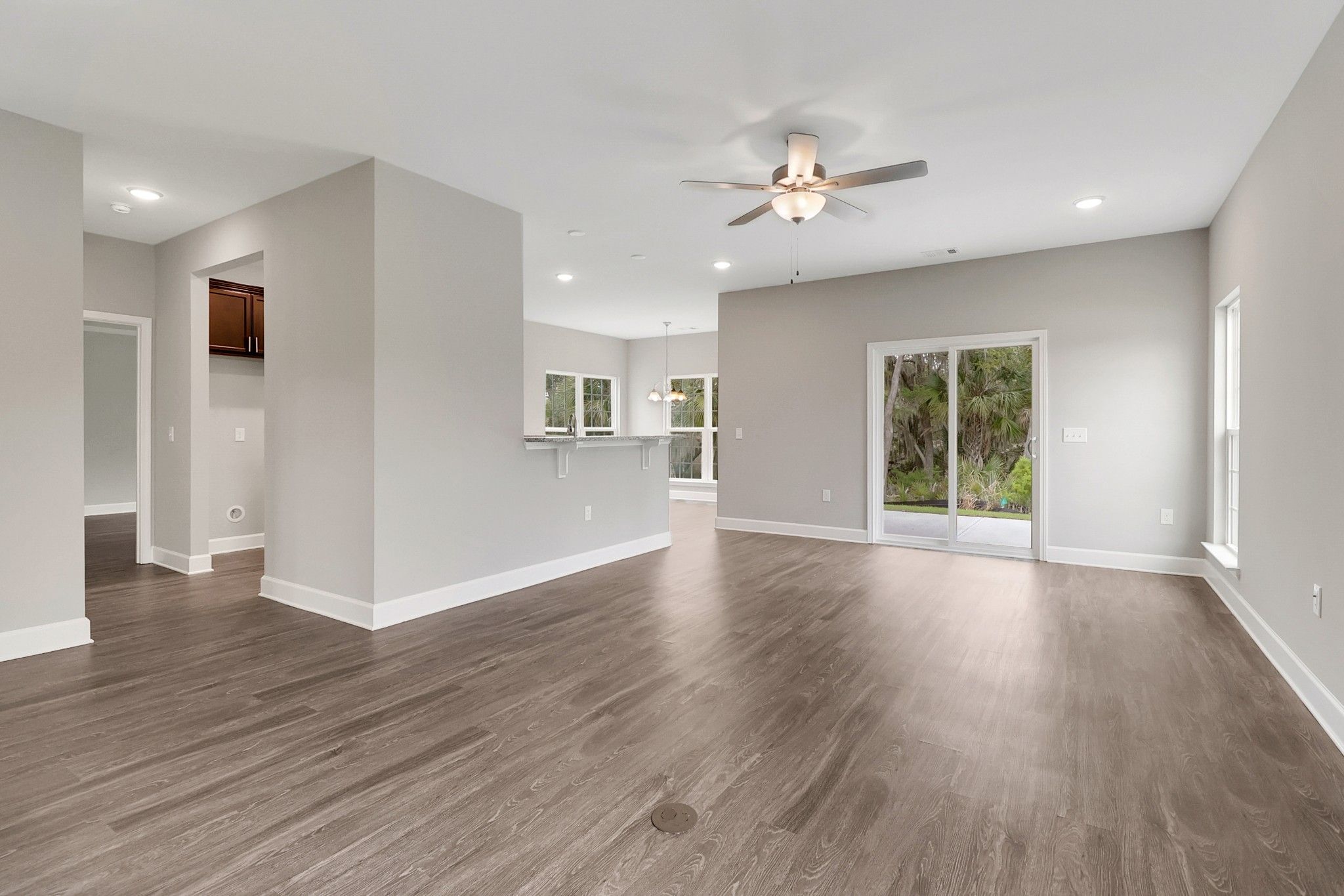Harbor – Living Room With Sliding Glass Door | Ernest Homes