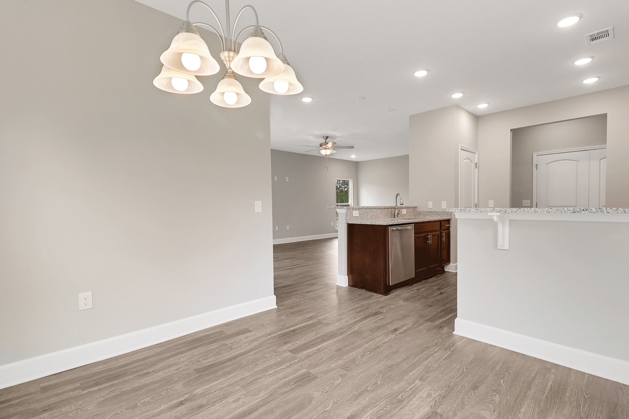 Harbor – Open Breakfast Area Overlooking Kitchen & Living Room | Ernest Homes