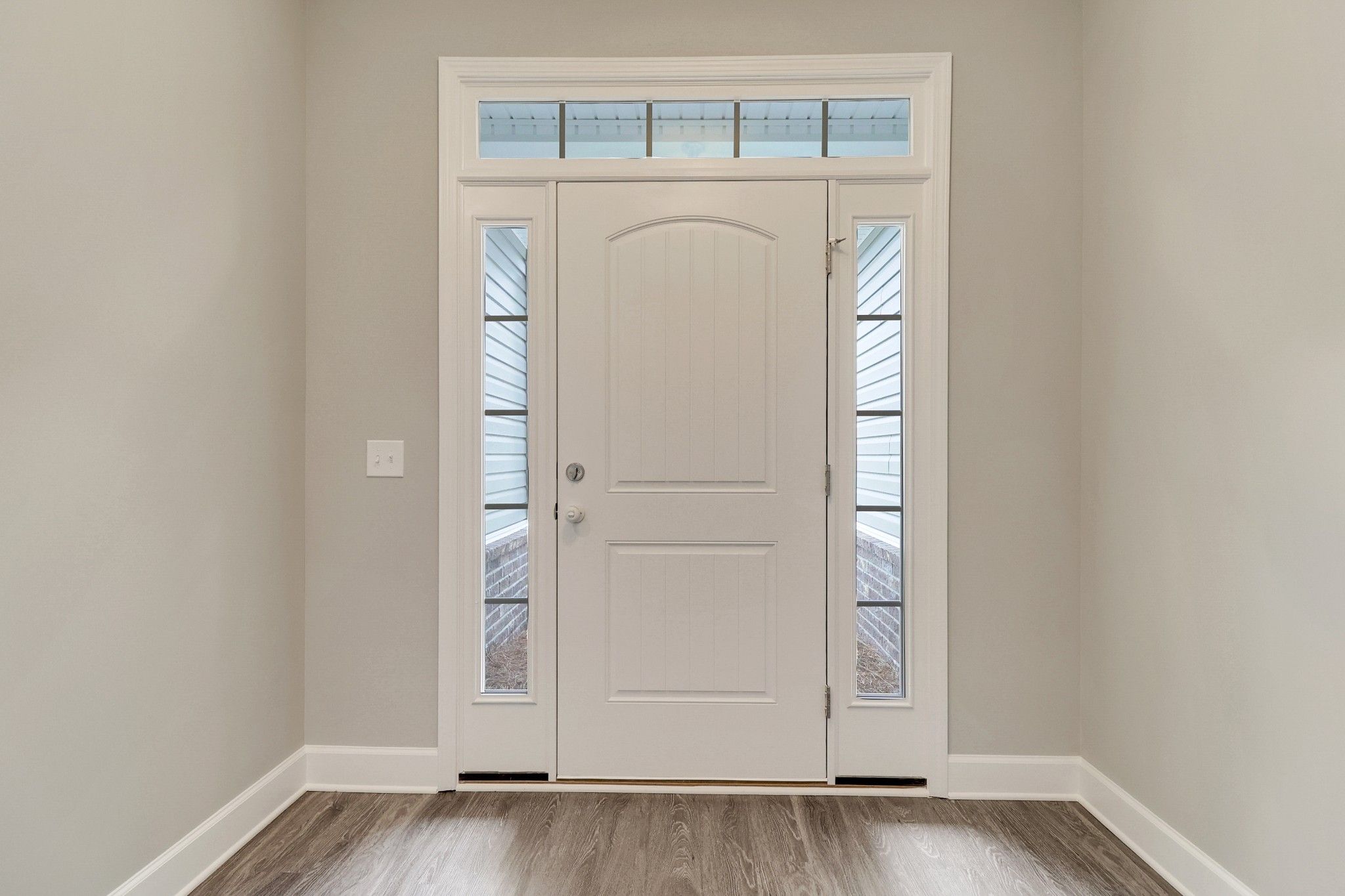 Harbor – Foyer with Front Door, Sidelights, and Transom | Ernest Homes