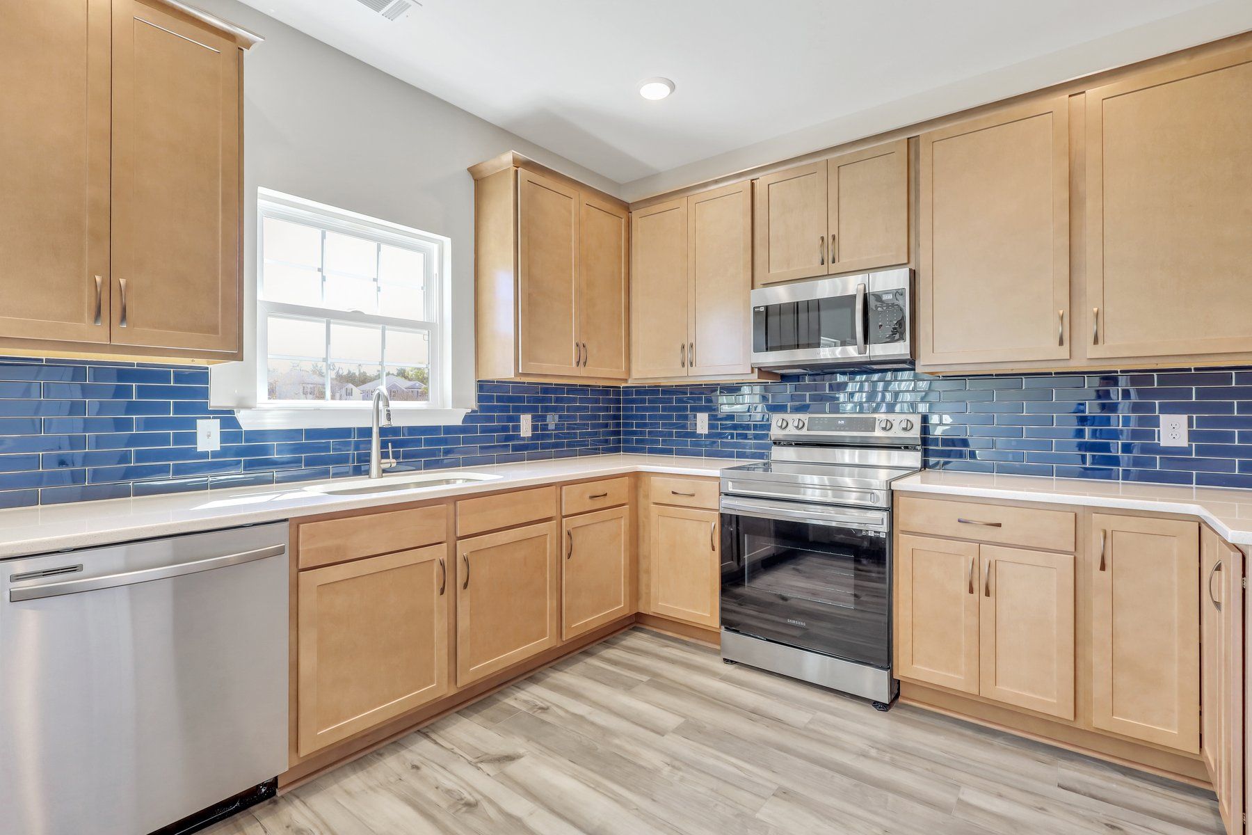 Daufuskie Kitchen | Wood Cabinets & Blue Backsplash