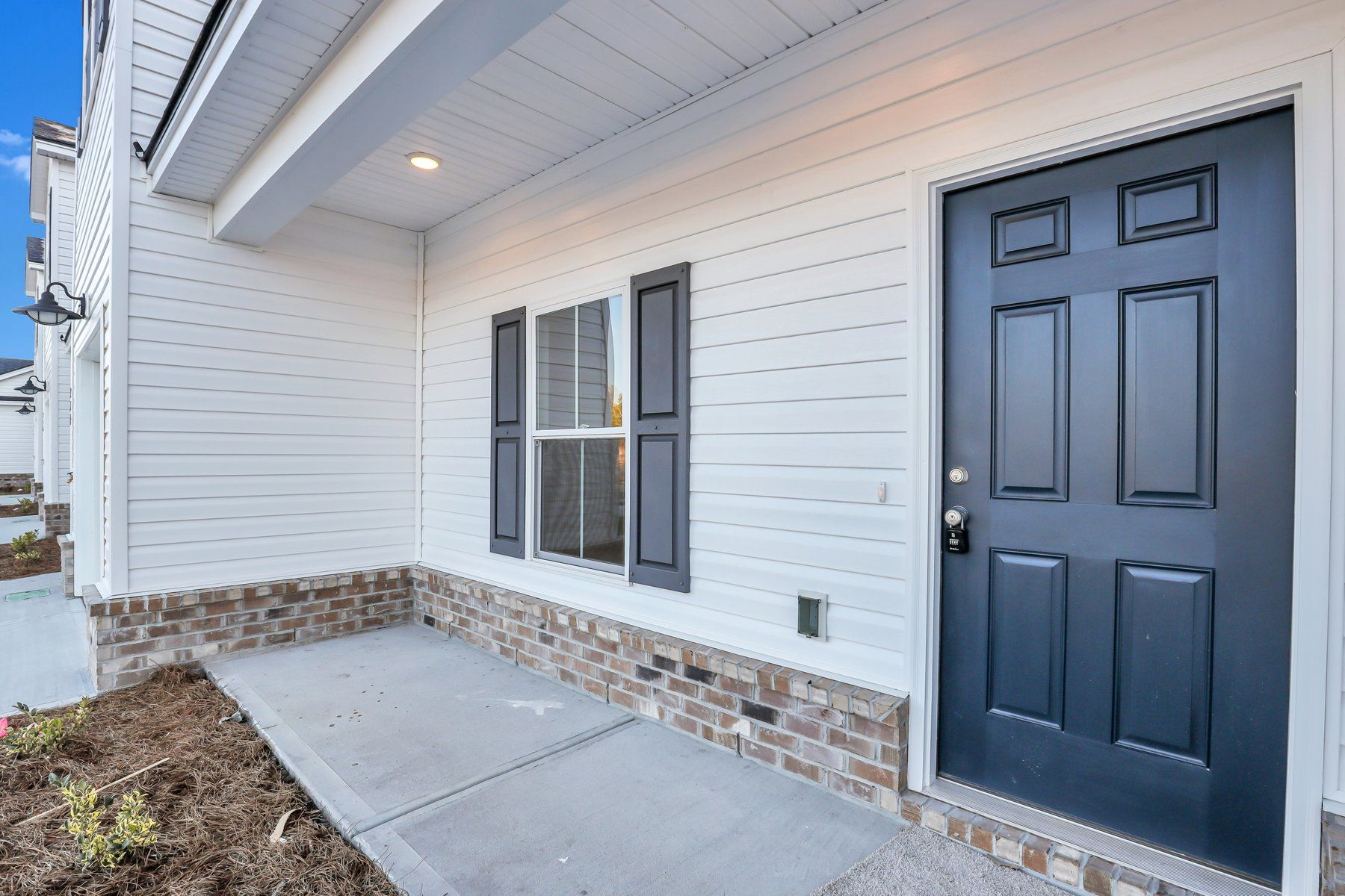 New Haven Townhome B - Front Covered Porch | Ernest Homes