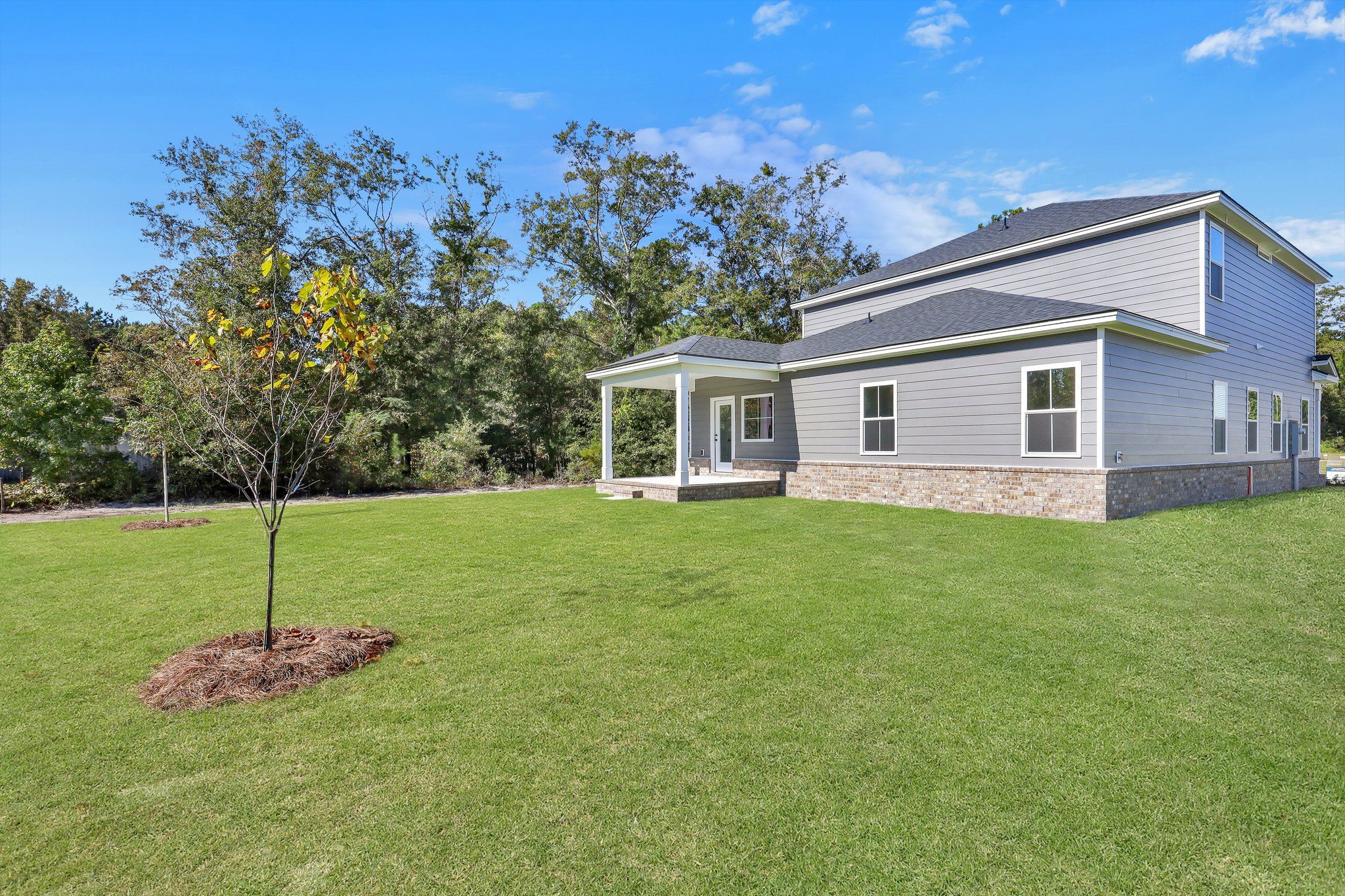 Hatteras Signature Rear Exterior With Covered Back Porch | Ernest Homes