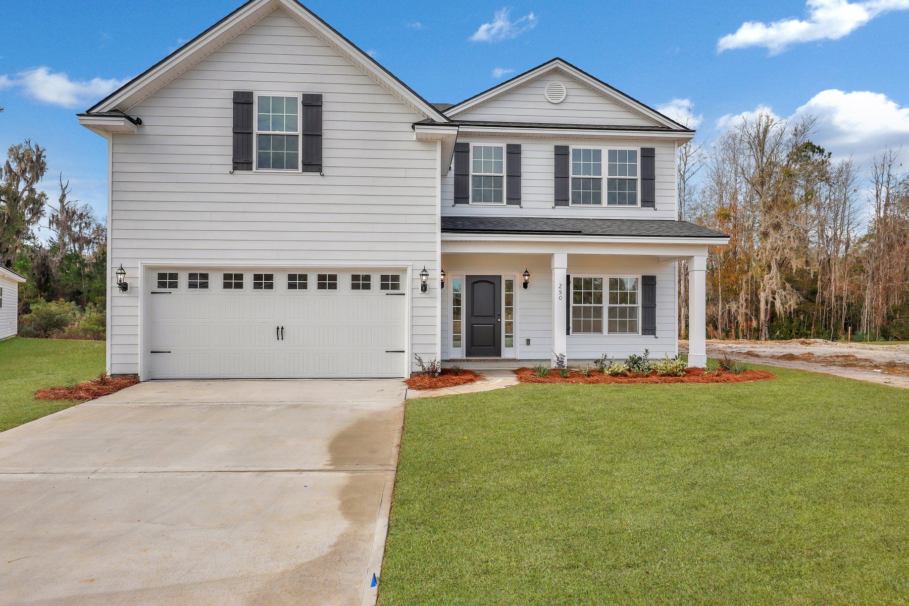 Front Elevation A with optional extended front porch of Nantucket plan built by Ernest Homes