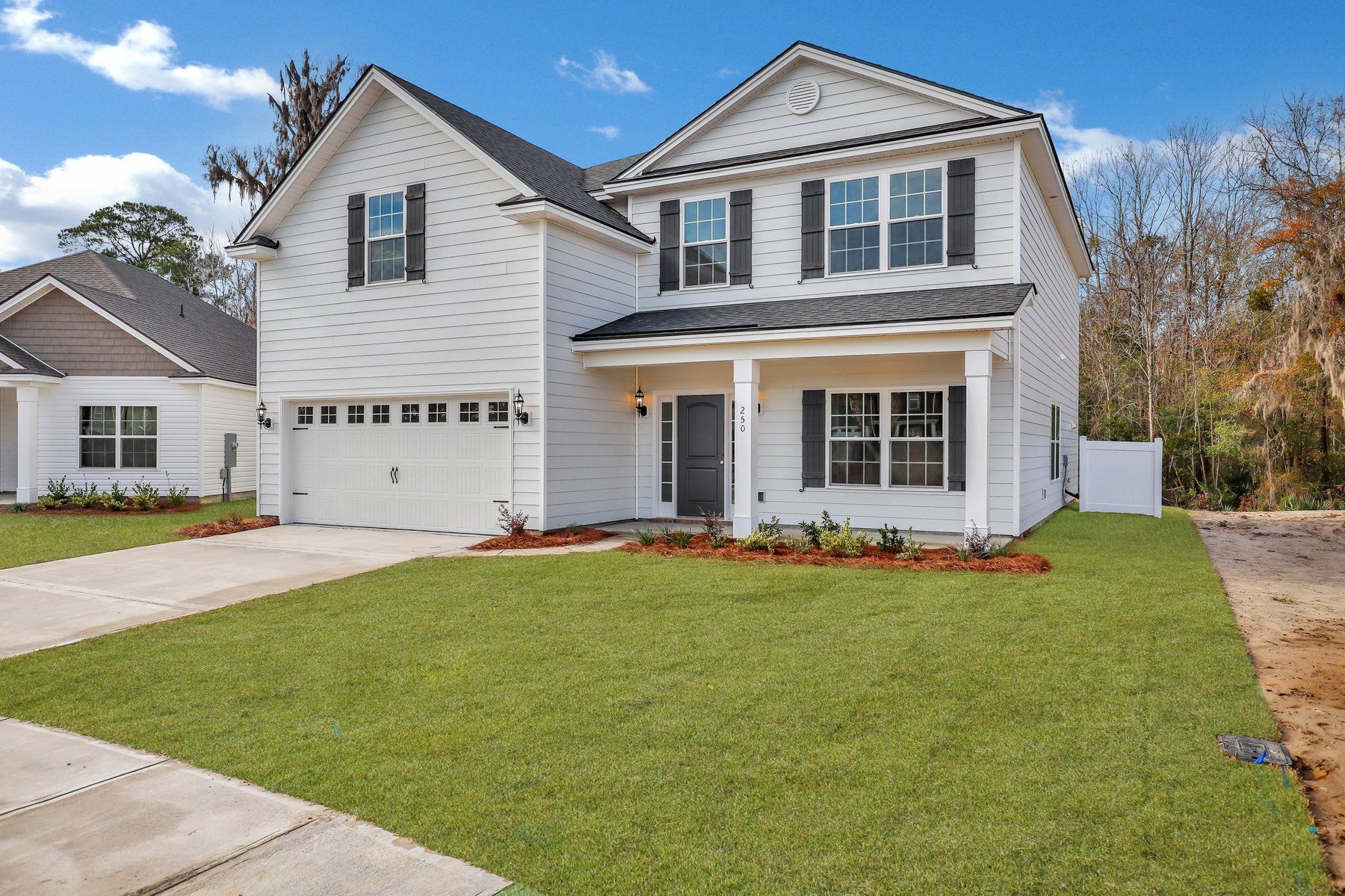 Front Elevation A with optional extended front porch of Nantucket plan built by Ernest Homes