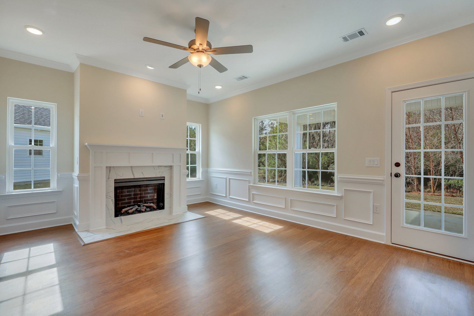 Fireplace and Wainscoting in Family Room - Nantucket plan  | Ernest Homes