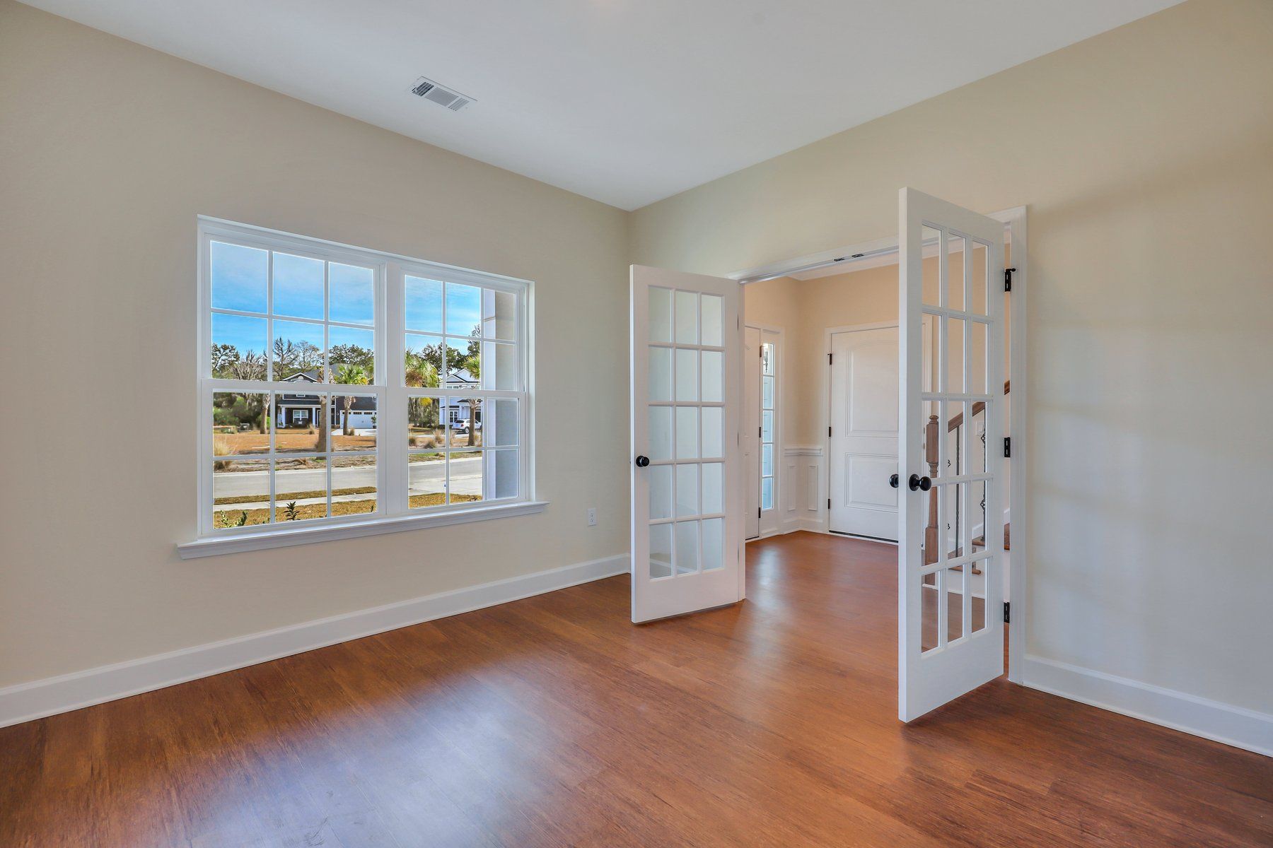 Nantucket - Living room enclosed with optional French doors -  | Ernest Homes