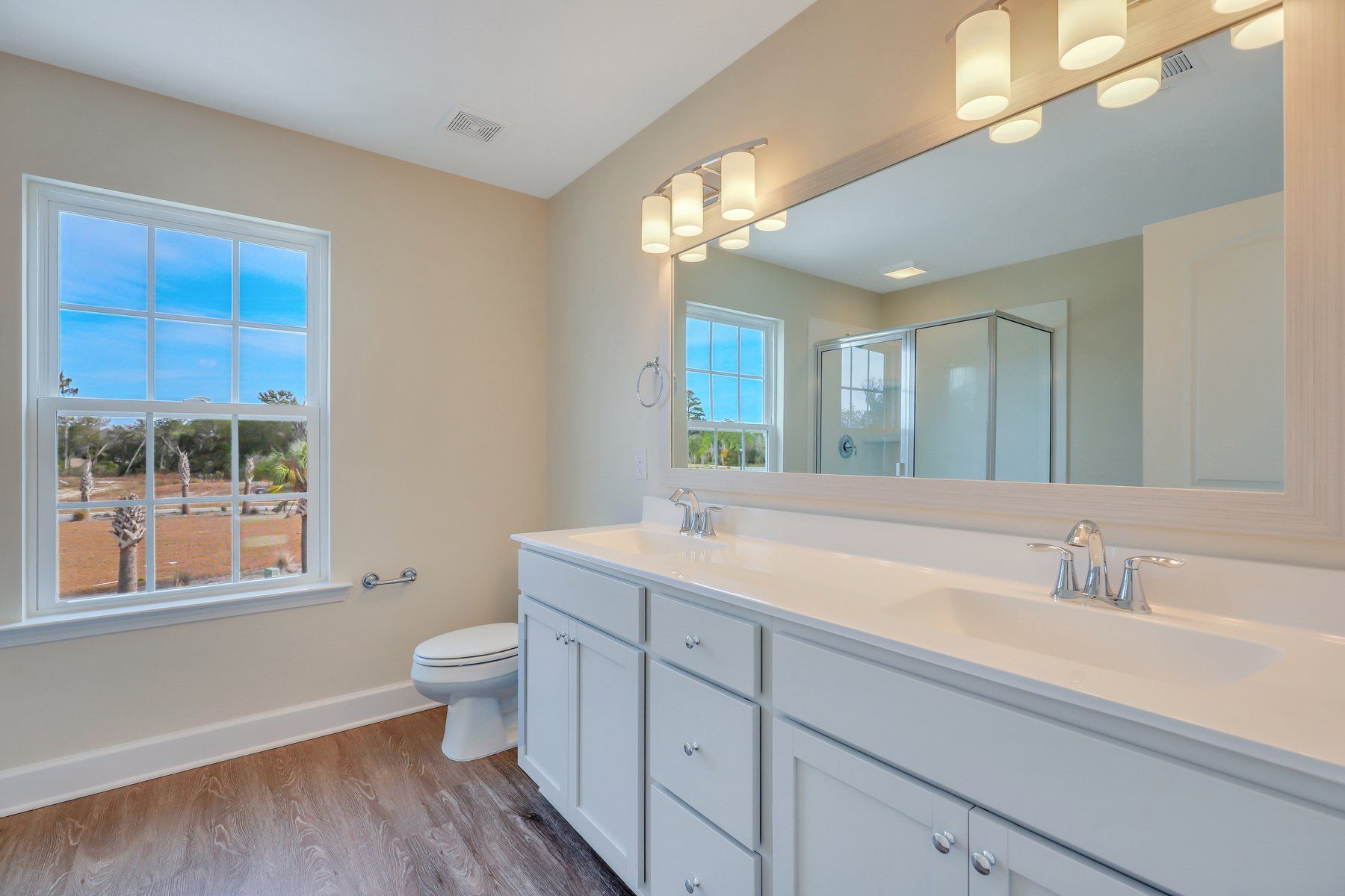 Nantucket - Owner's Bath - Marble shower with half wall - | Ernest Homes