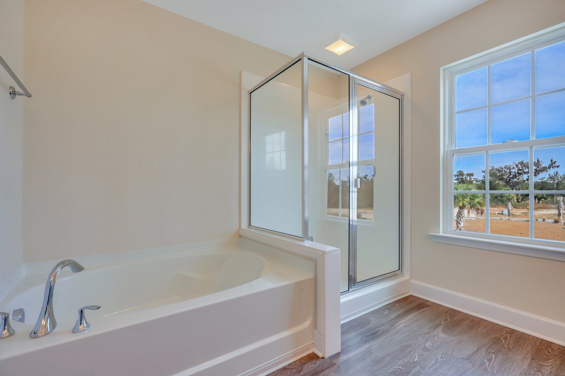 Nantucket Marble shower with half wall - | Ernest Homes