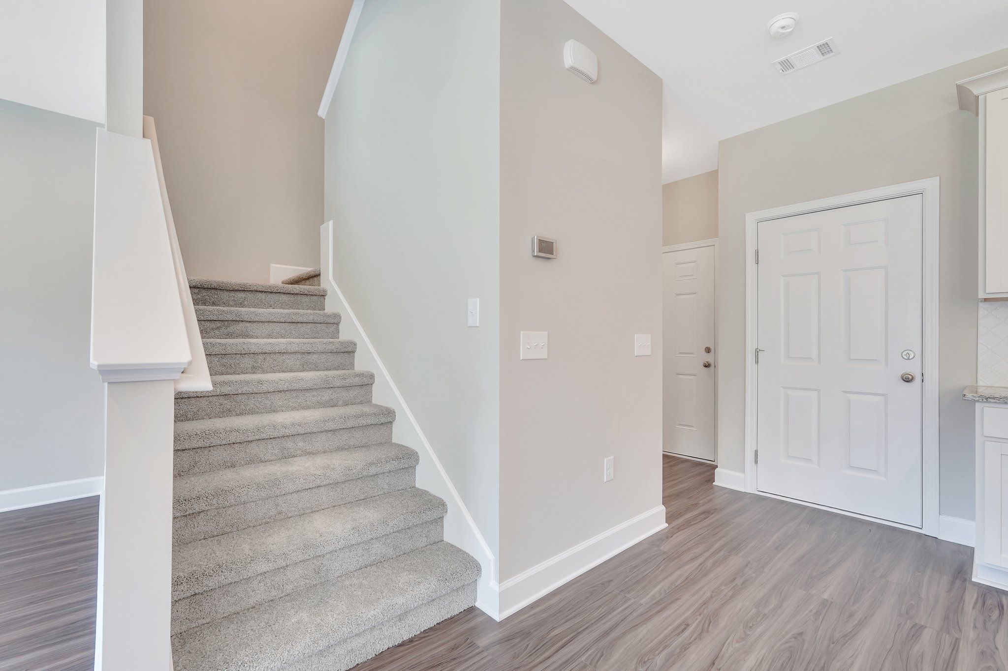 Madison - Stairs and Garage Entry | Ernest Homes