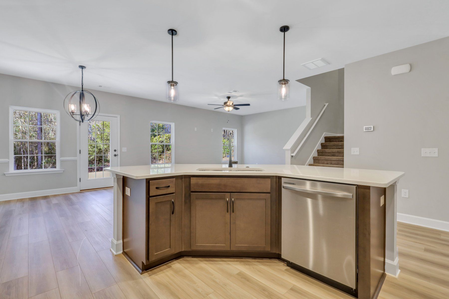 Madison - Kitchen Island with a view into Dining Area and Family Room  | Ernest Homes