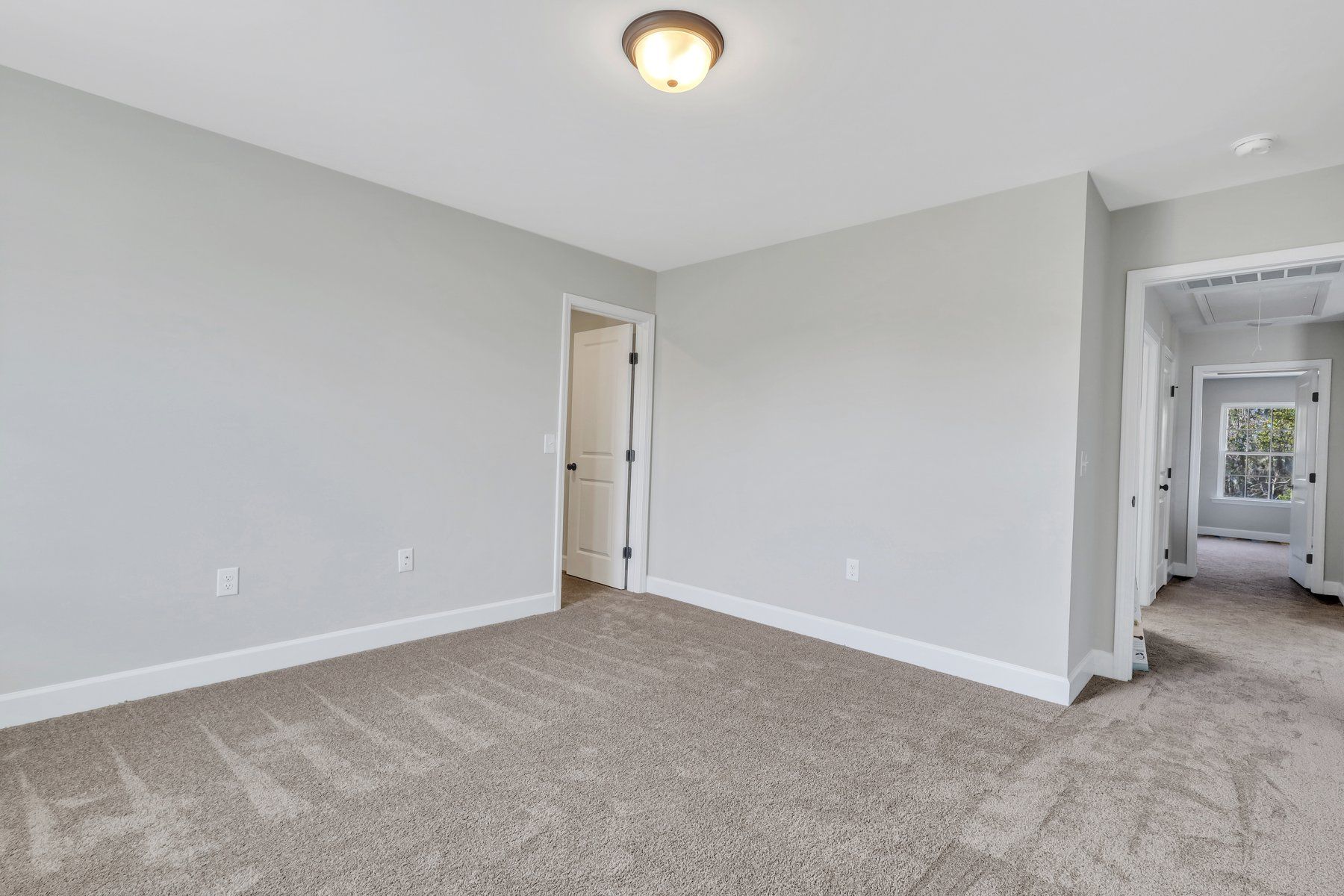 Madison - Bedroom 2 with a view into the Upstairs Hallway | Ernest Homes