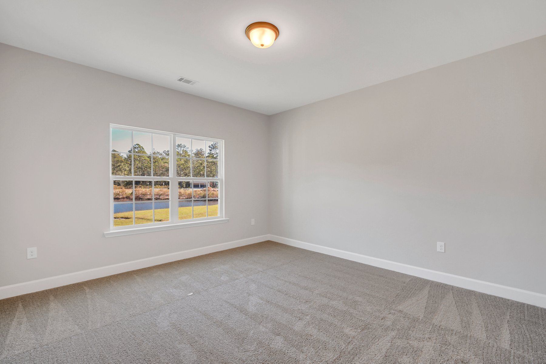Hilton – Main Floor Bedroom 5 | Ernest Homes