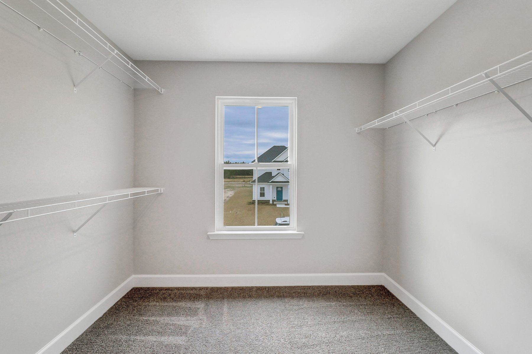 Greybeard Owner’s Suite Walk-In Closet | Ernest Homes