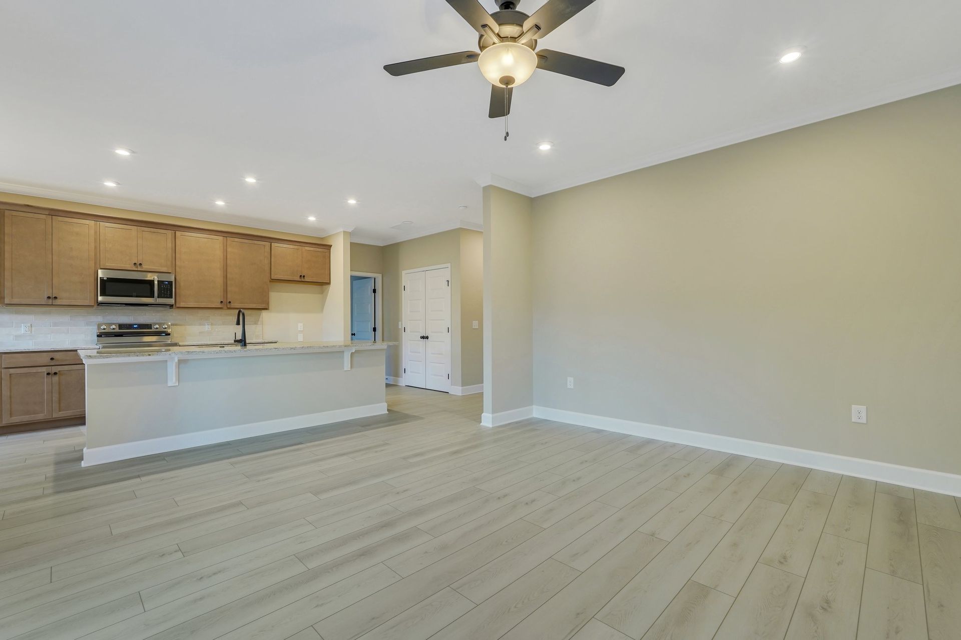 Harbor II Kitchen with Wood Cabinets and Open Living Space