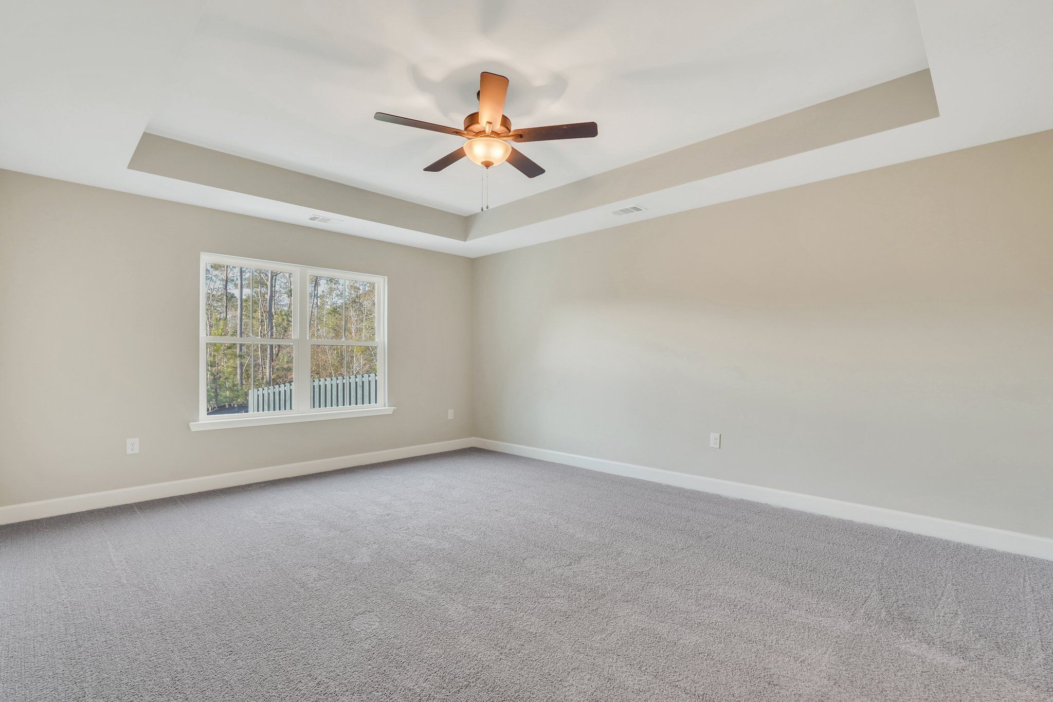 Harbor II Main Primary Suite with Tray Ceiling and Rear Window
