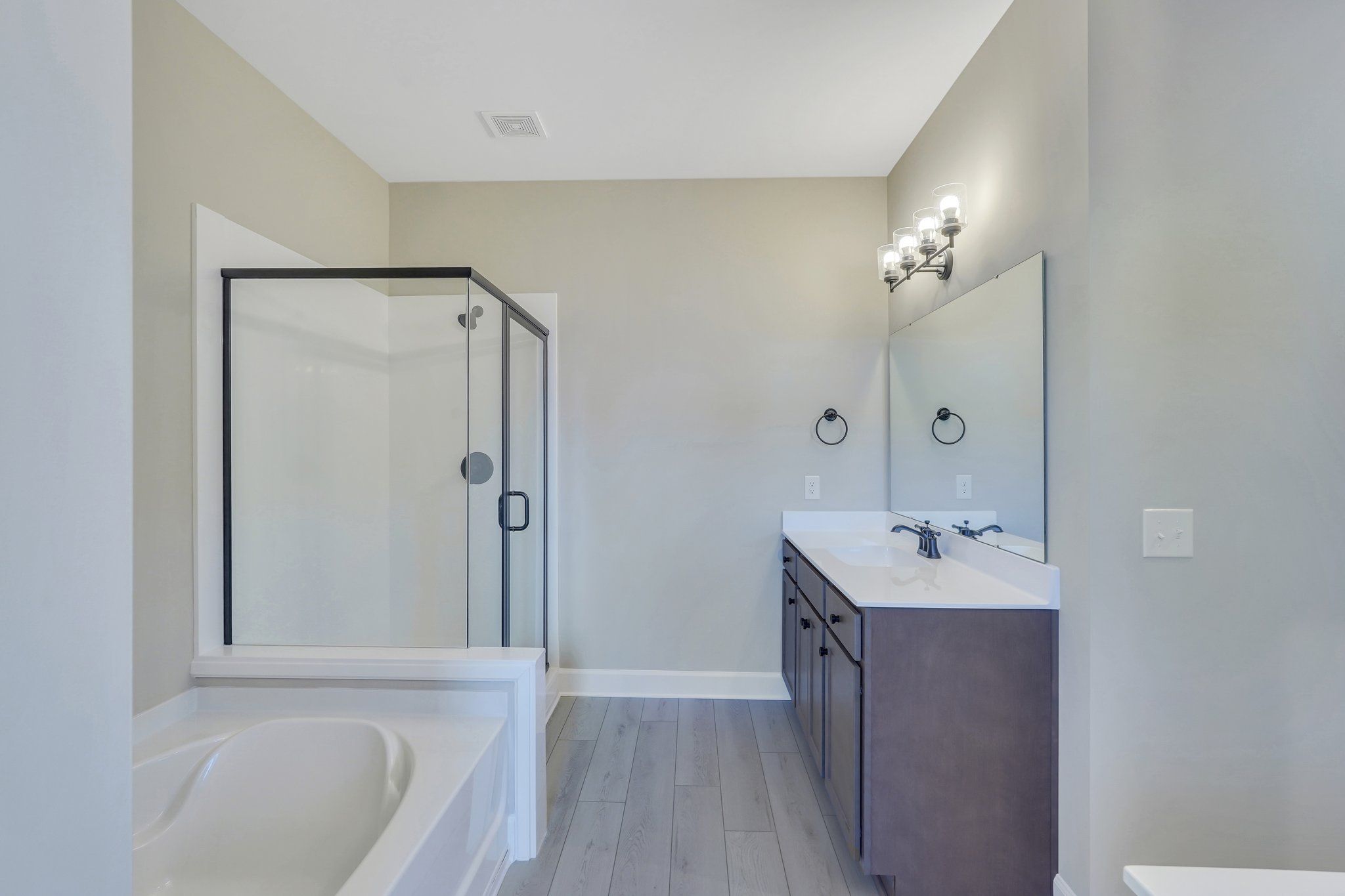 Harbor II Main Primary Bathroom with Glass Shower and Dual Vanity