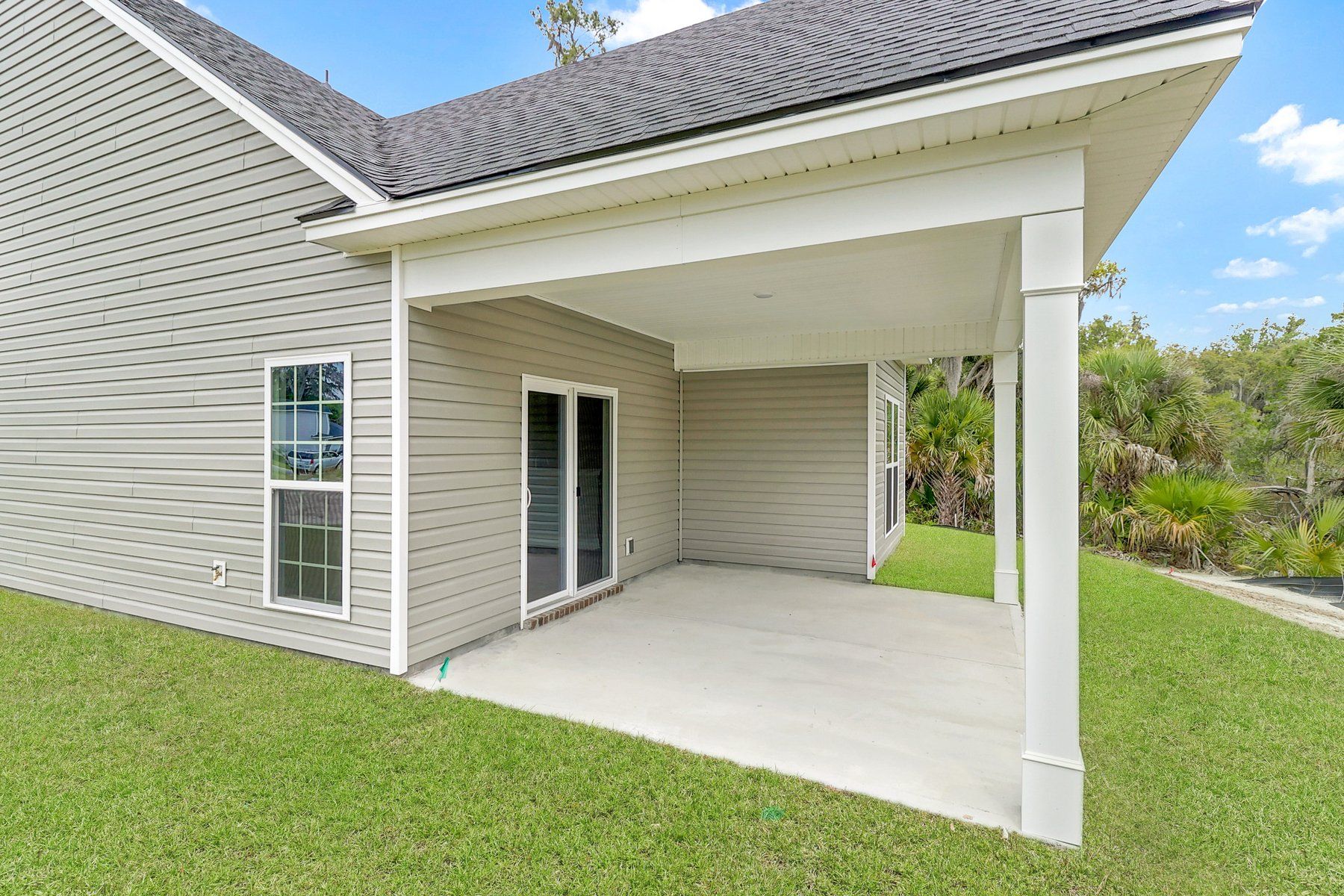 Harbor – Angled View of Exterior with Outdoor Living Space | Ernest Homes