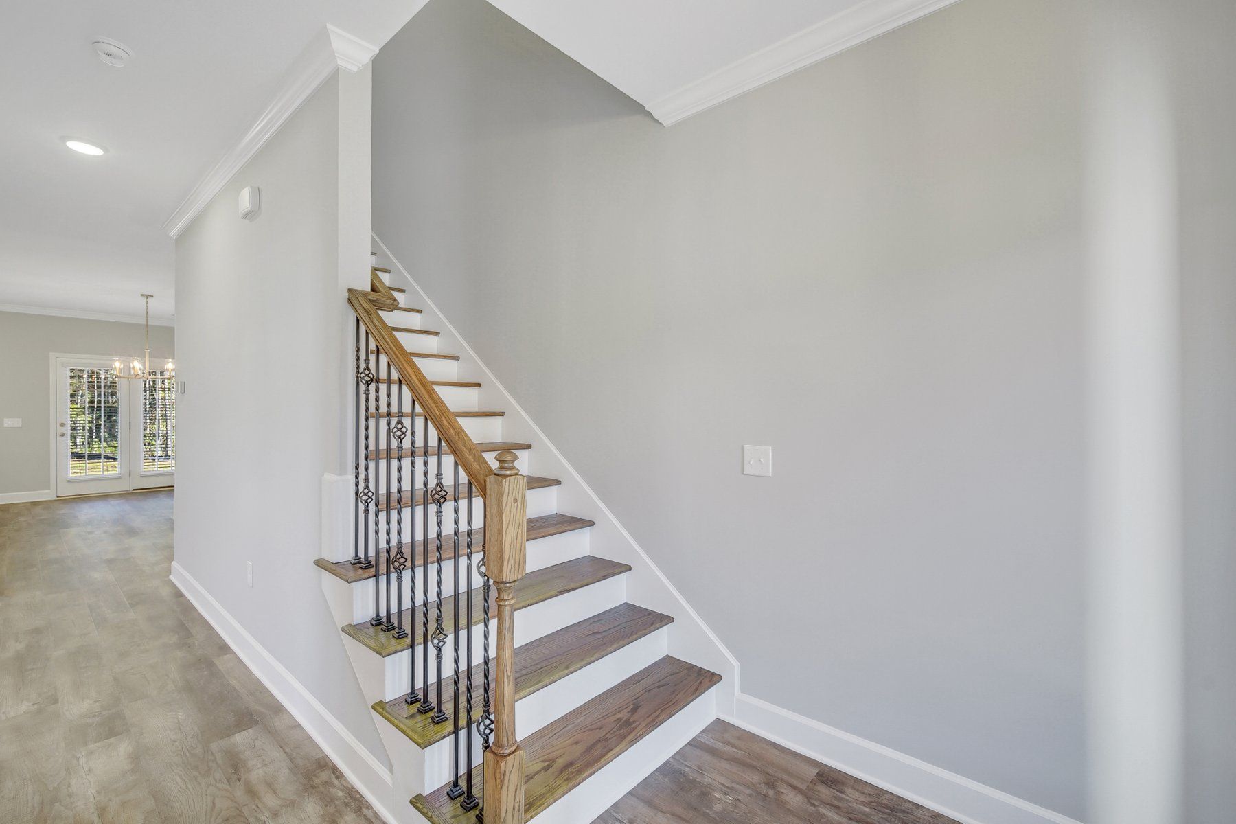 Nantucket Signature - Wood Treads on Stairs open rail with iron balusters | Ernest Homes