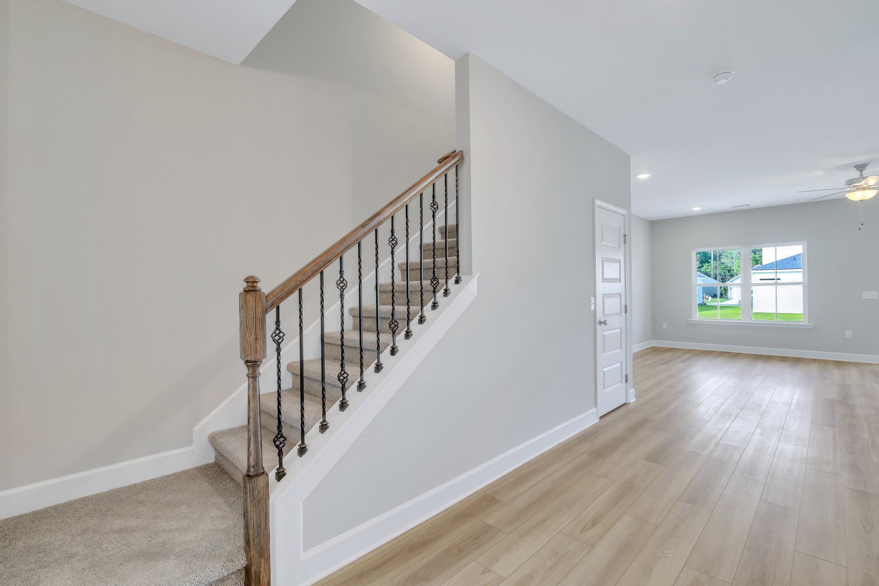 Seabrook - Foyer and optional oak & iron stair railing  | Ernest Homes