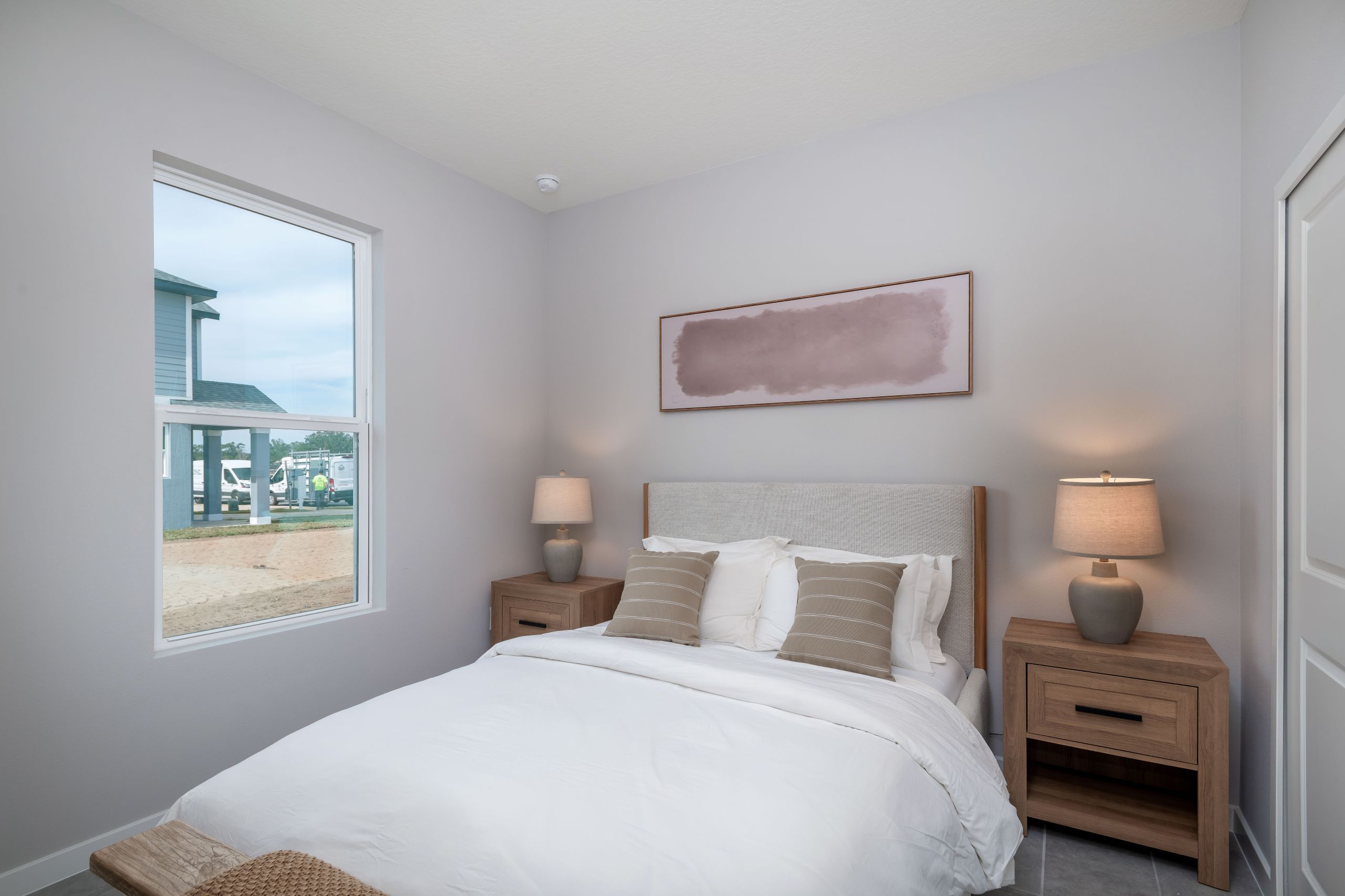 A welcoming third bedroom designed for flexibility, offering ample space for rest, work, or personalized décor.