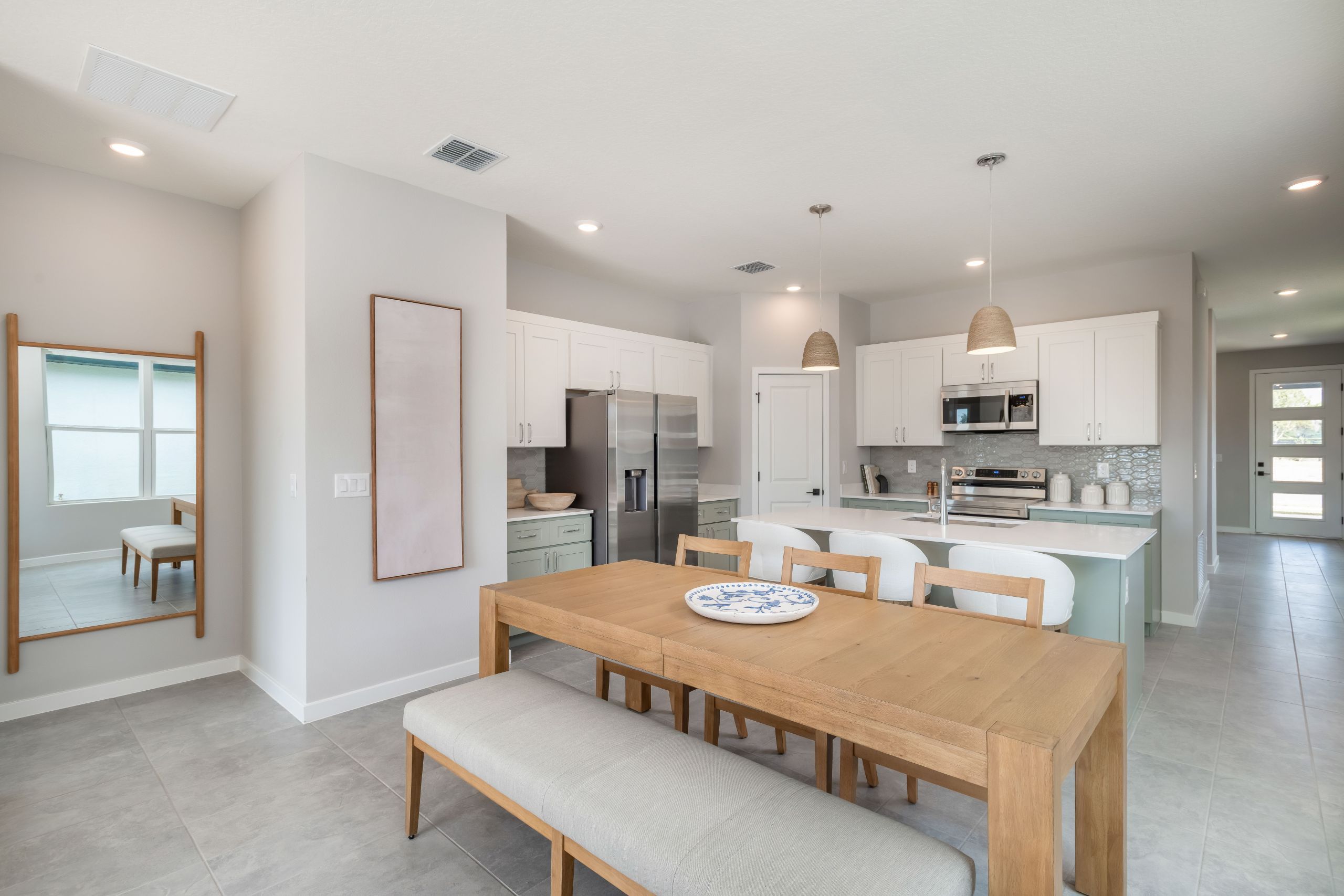 Beautiful open-concept design featuring a modern kitchen that flows seamlessly into the dining area—perfect for everyday living and entertaining.