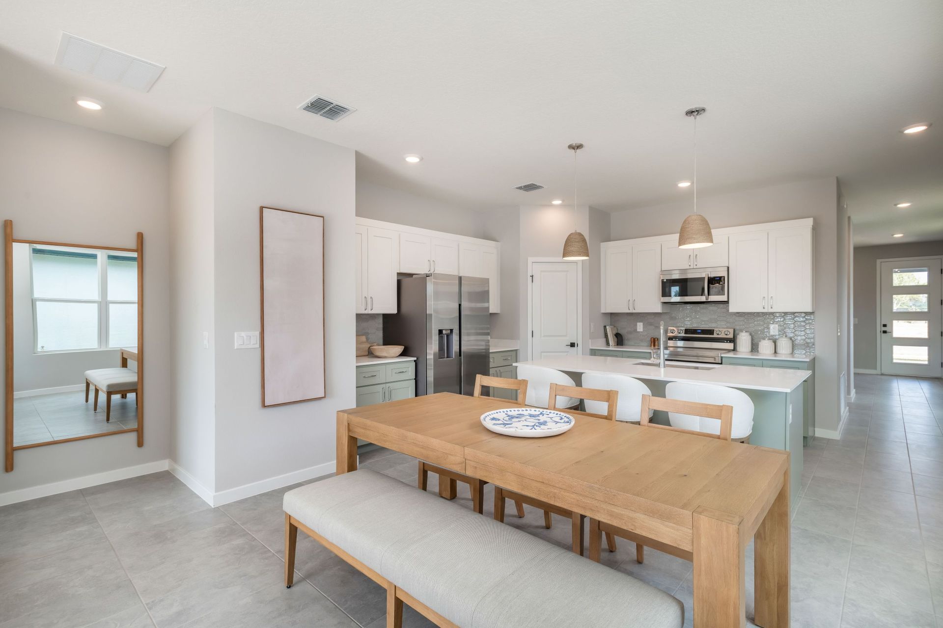 Beautiful open-concept design featuring a modern kitchen that flows seamlessly into the dining area—perfect for everyday living and entertaining.