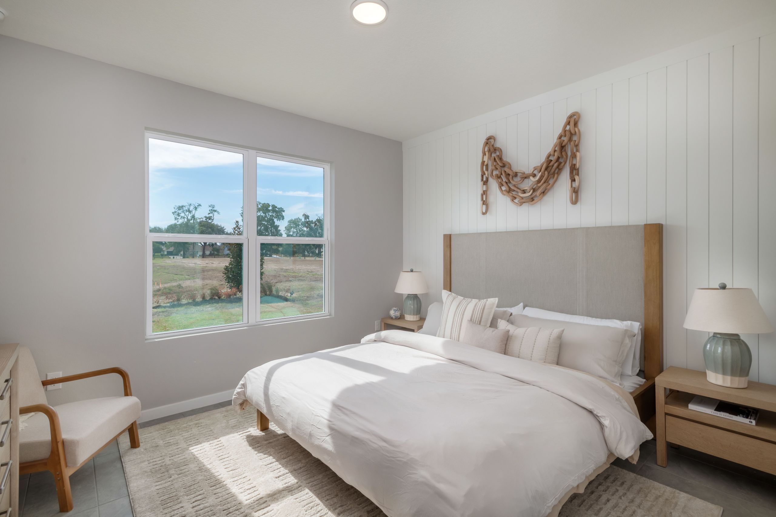 A serene primary suite designed for relaxation, featuring generous proportions and soft natural lighting for a peaceful retreat.