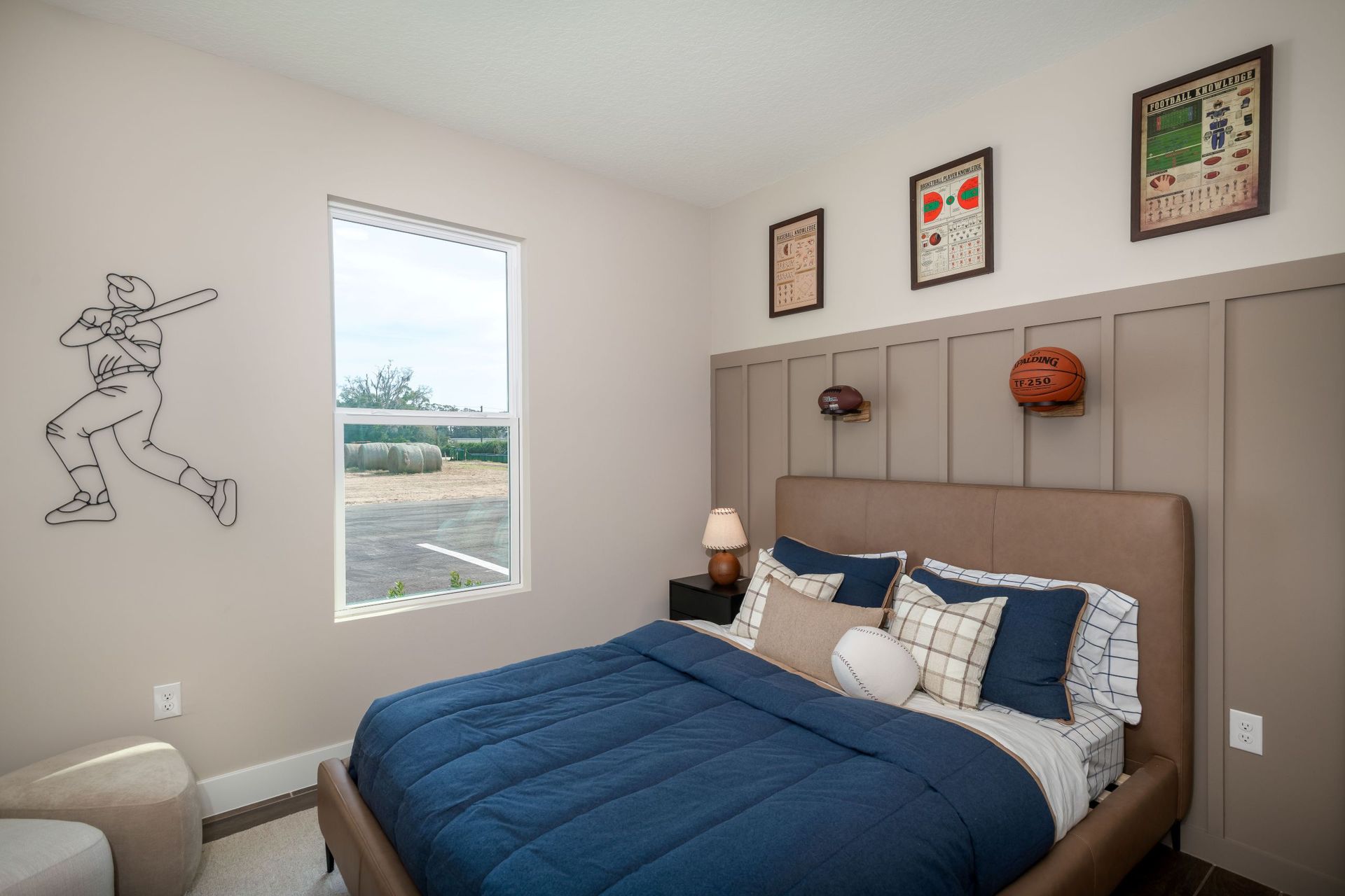 A cozy secondary bedroom with abundant natural light and a versatile layout perfect for guests, children, or a personal retreat.