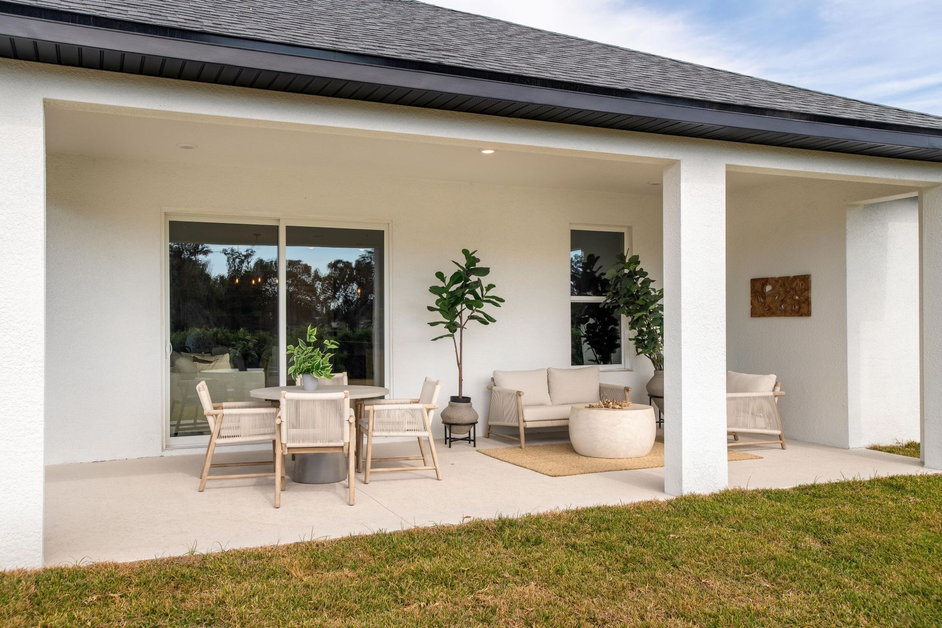 A relaxing covered lanai designed for year-round outdoor enjoyment, with space for dining, lounging, and taking in the natural surroundings.