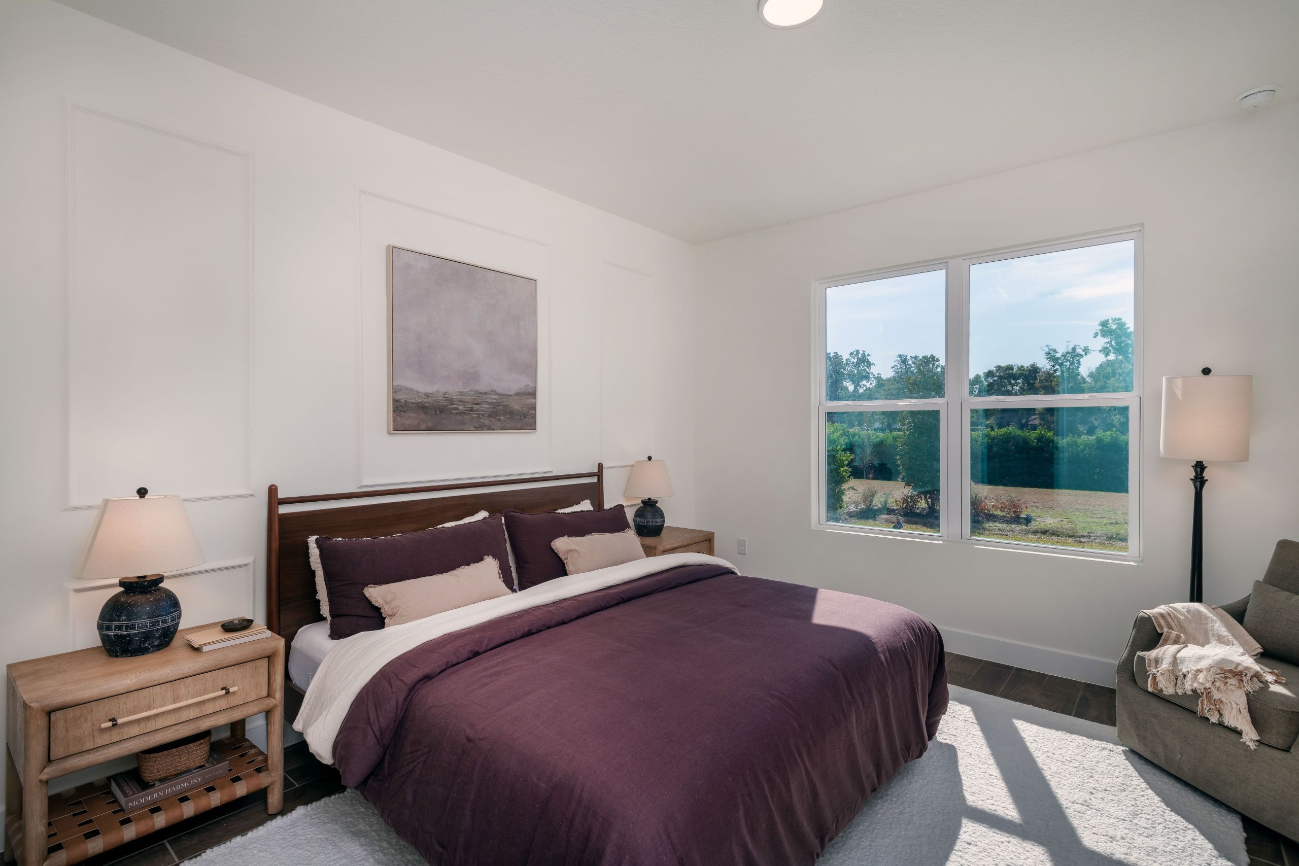 An inviting bedroom offering ample space, soft natural light, and flexibility for various living needs or décor styles.