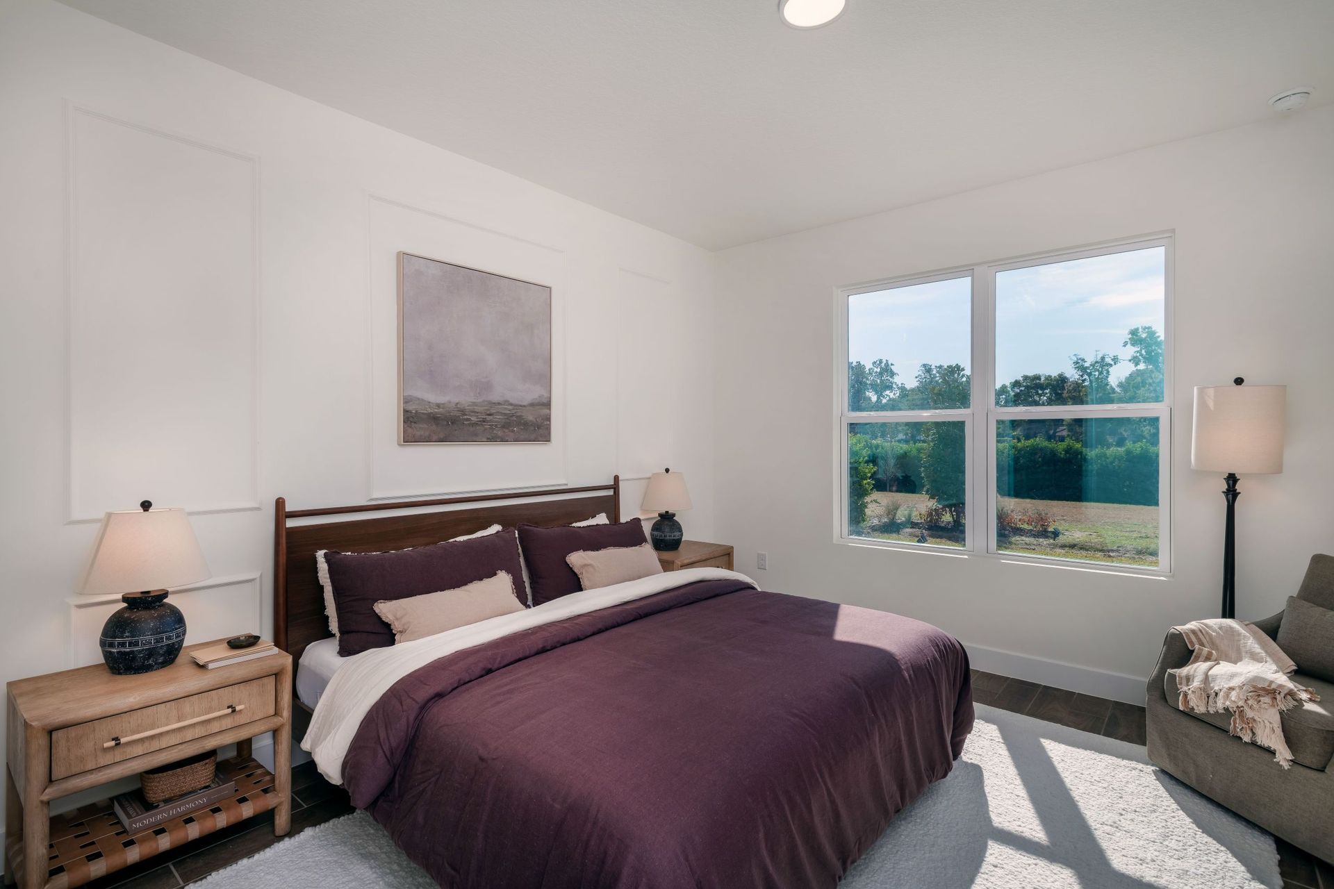 An inviting bedroom offering ample space, soft natural light, and flexibility for various living needs or décor styles.