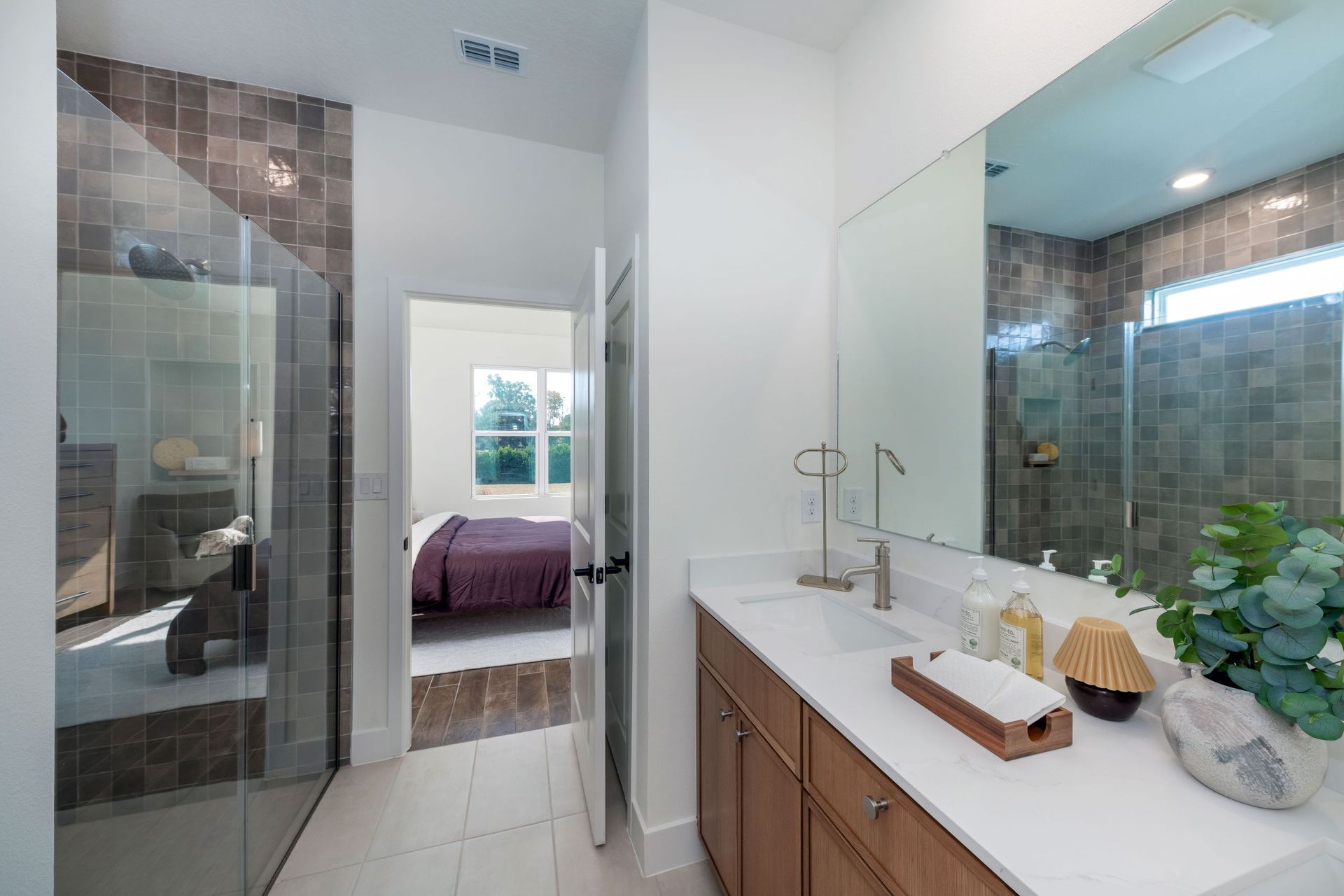 A spa-inspired primary bathroom with dual sinks, a spacious shower, and thoughtfully selected finishes for everyday comfort and luxury.