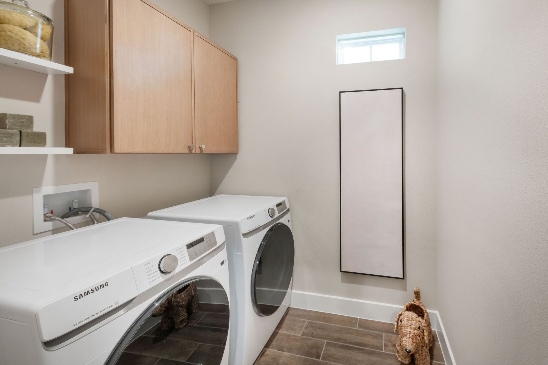 A well-planned laundry room featuring built-in storage and efficient design to simplify daily routines and maximize organization.