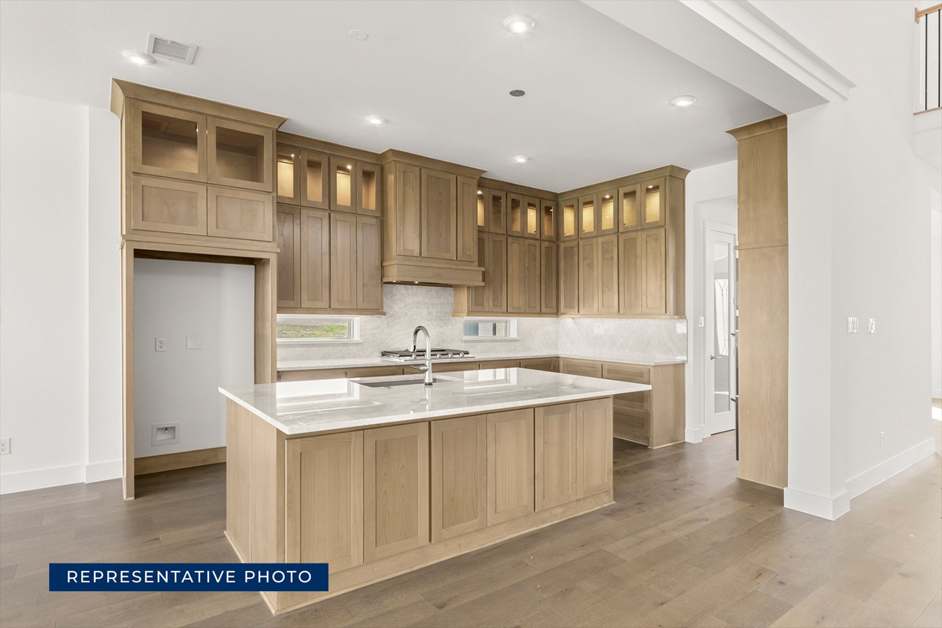 Modern kitchen with wooden cabinets and marble countertops