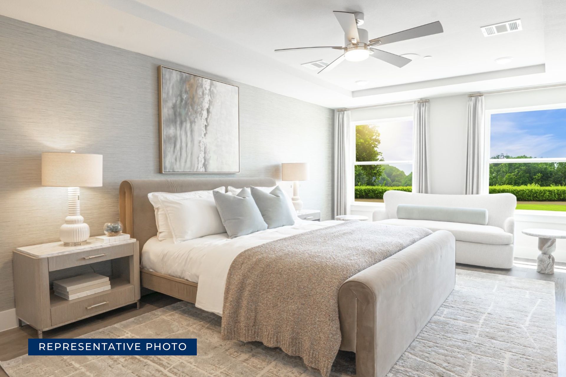 Modern bedroom with large bed, stylish decor, and bright natural light.