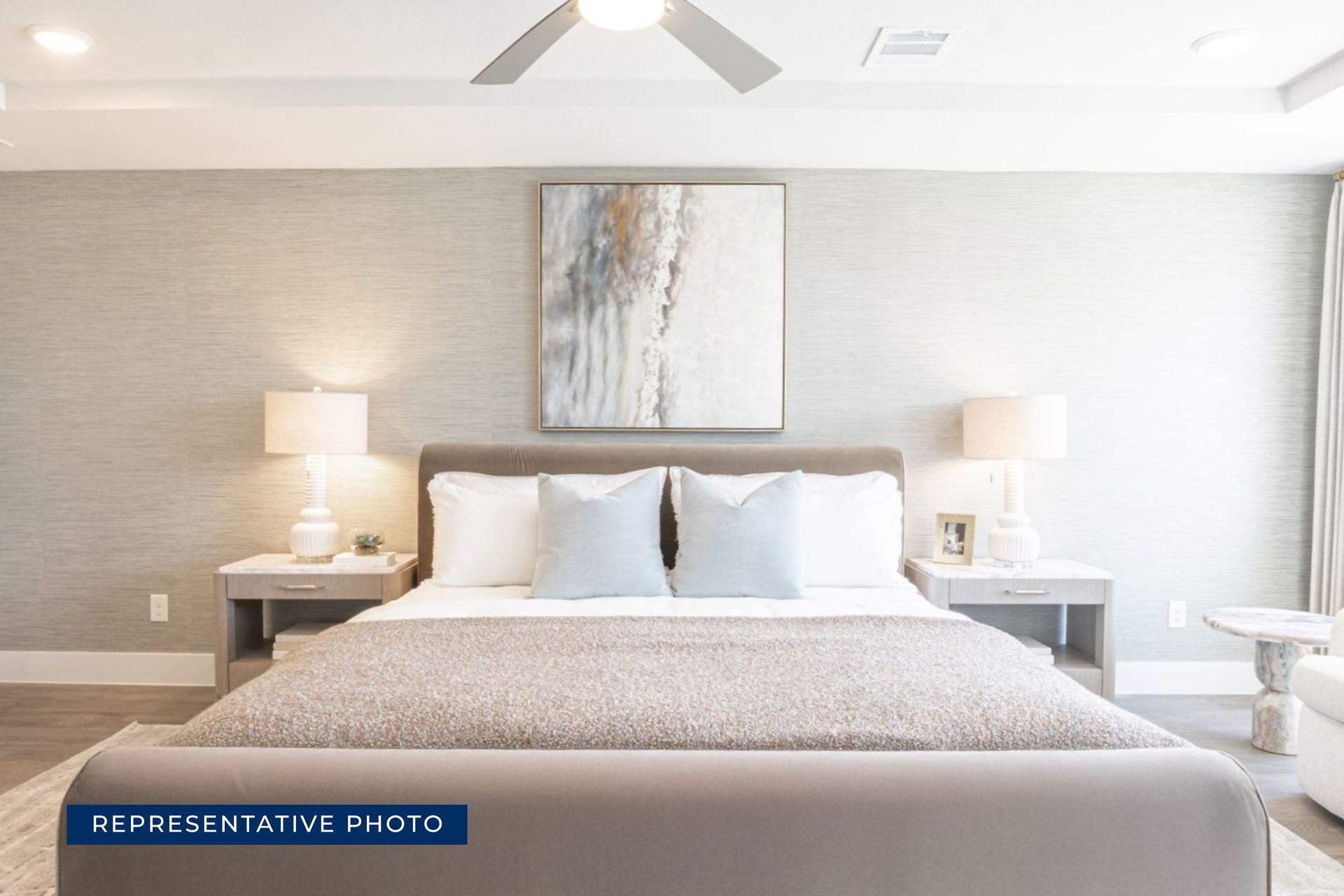 Modern bedroom with elegant decor and neutral color palette.