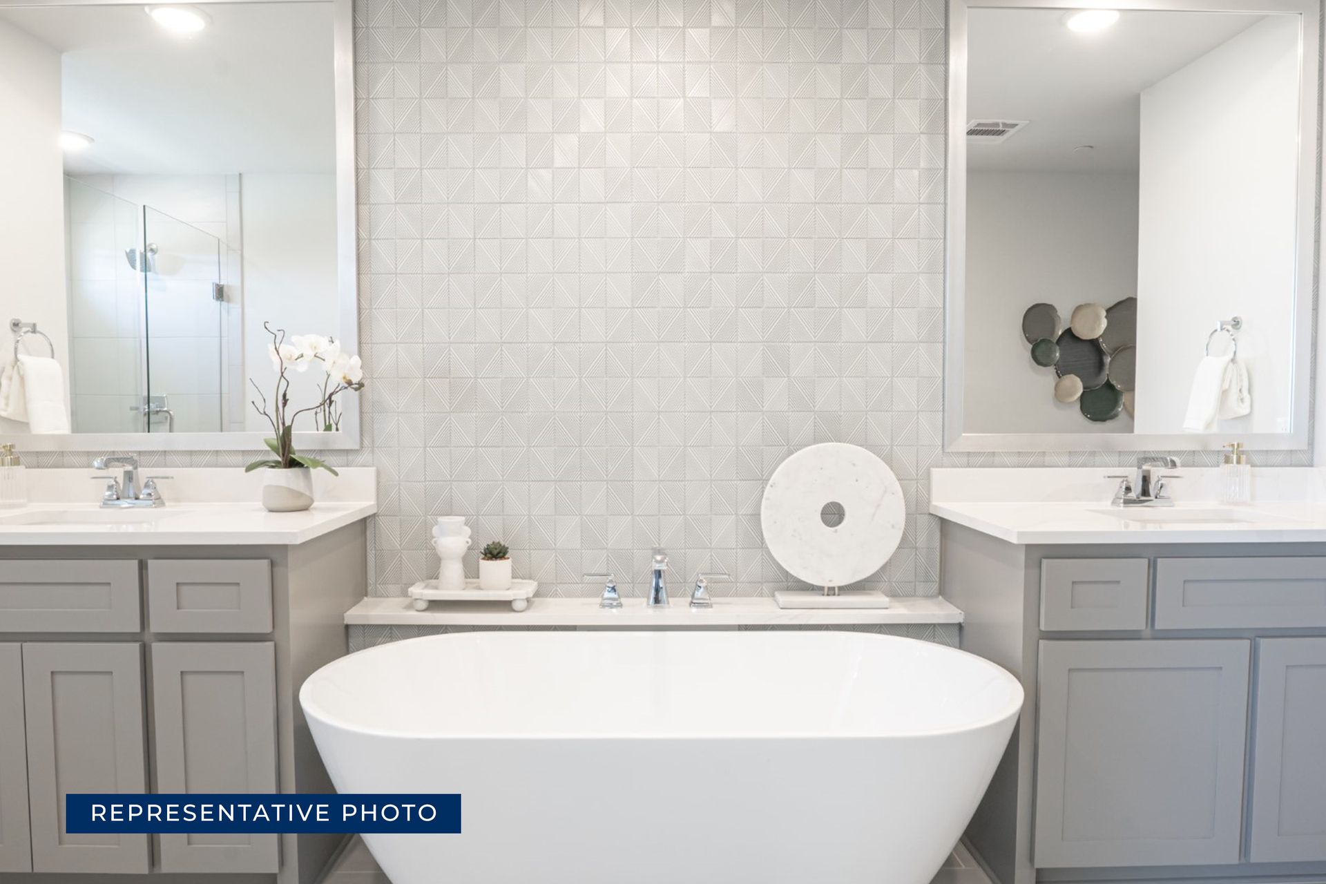 Modern bathroom with freestanding tub and dual vanities