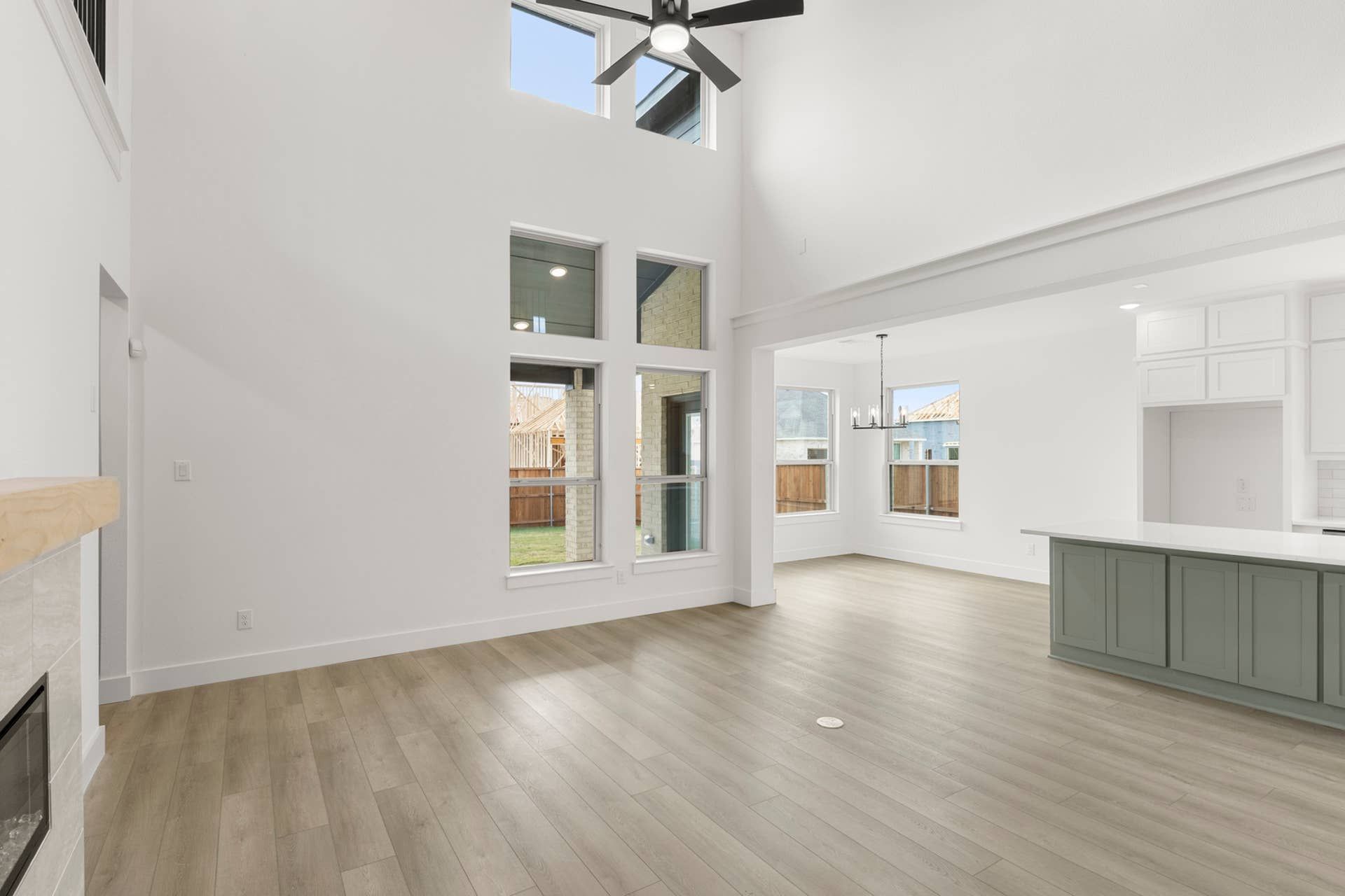 Spacious open-concept living area with high ceilings and abundant natural light.