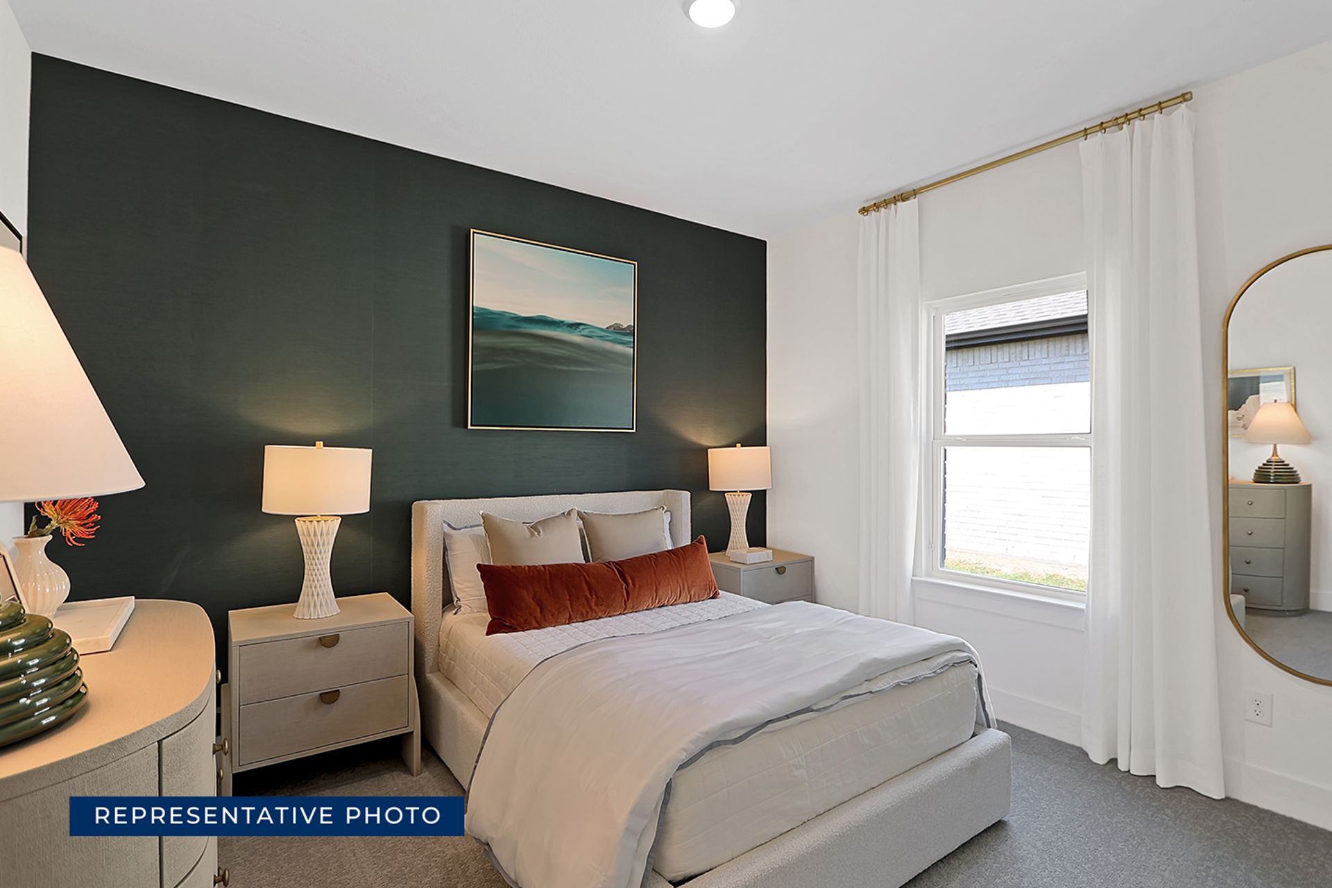 Modern bedroom with dark accent wall, bed, and stylish lamps.