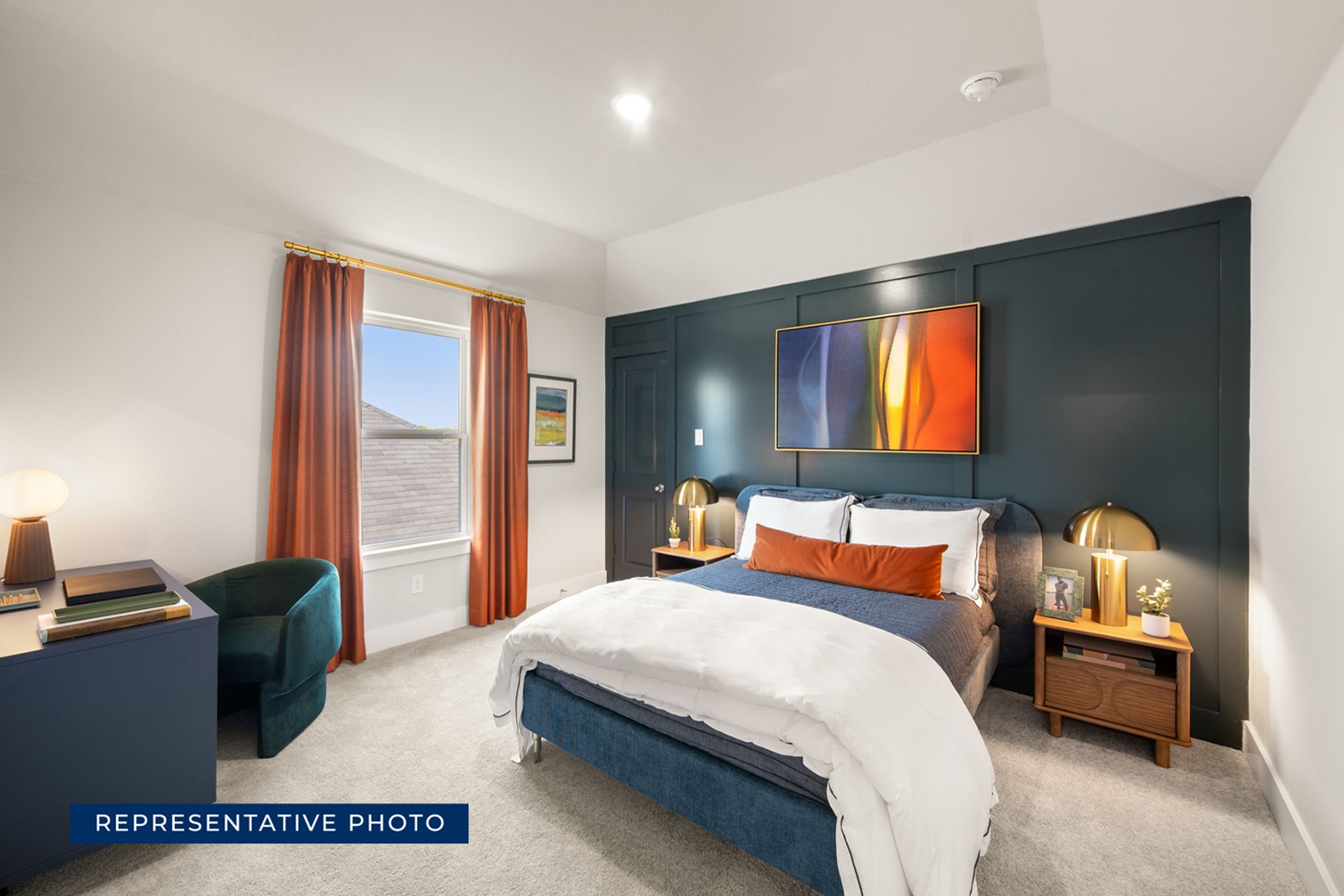 Modern bedroom interior with colorful art, orange curtains, and cozy bed.