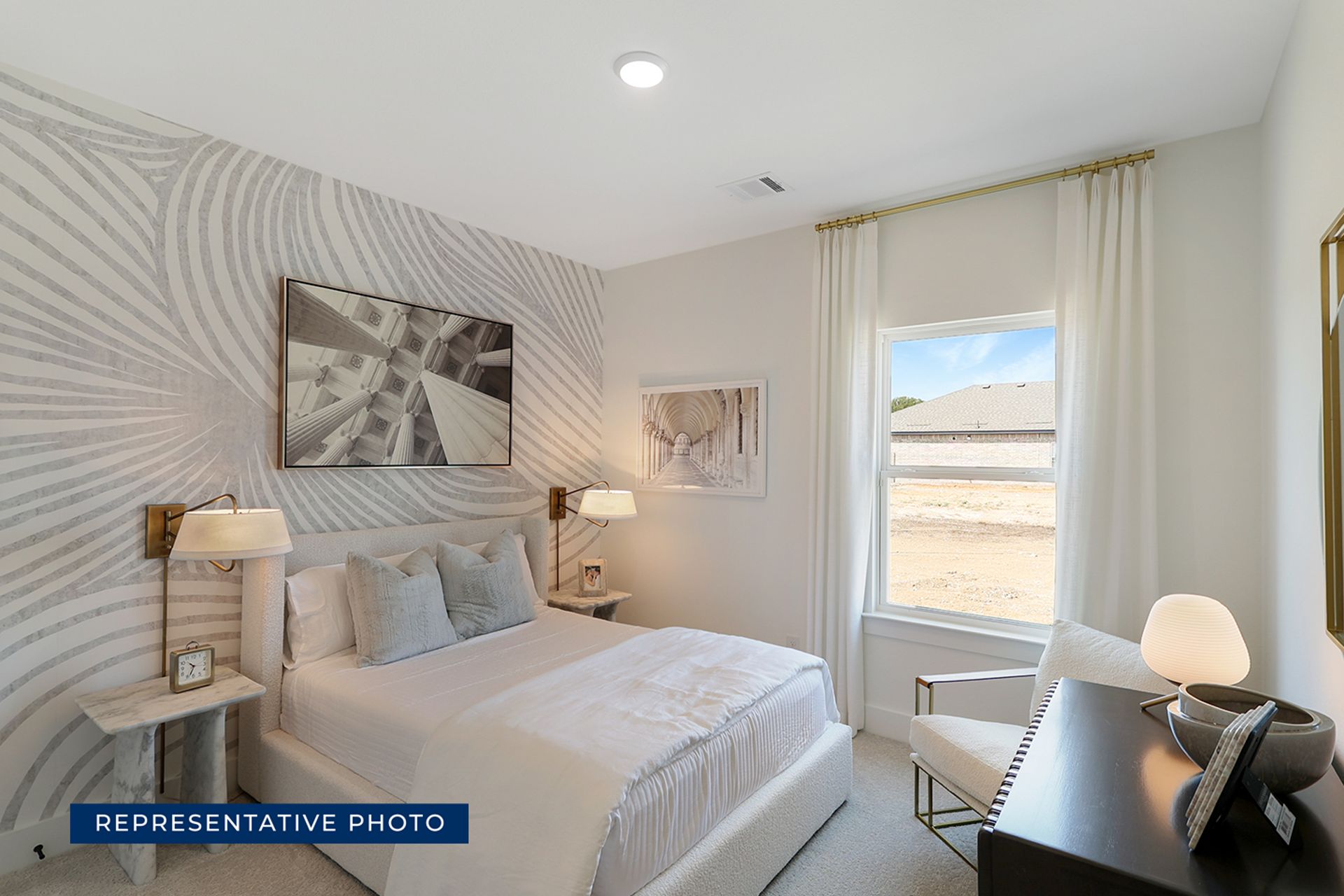 Modern bedroom with abstract wallpaper, large window, and elegant decor.