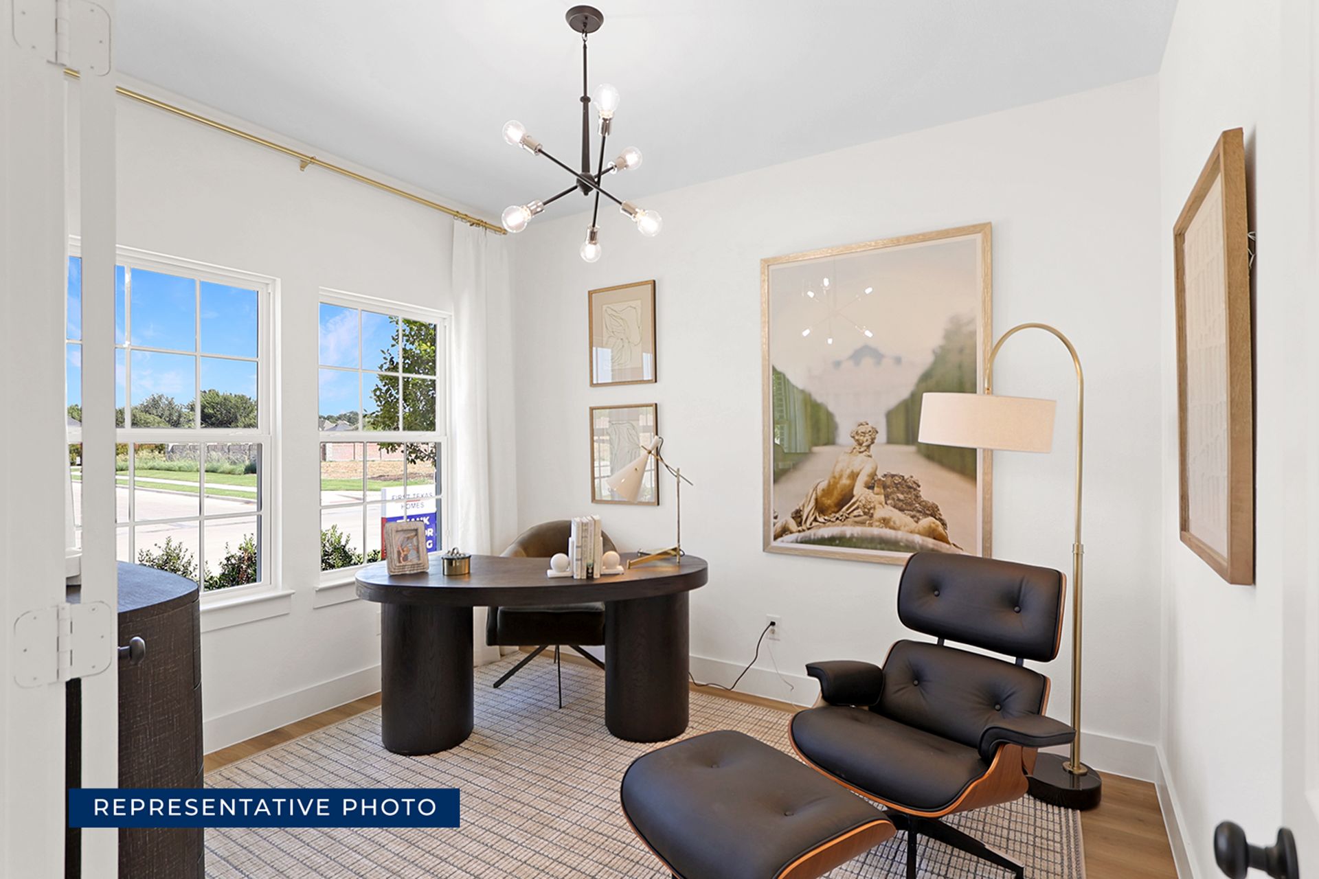 Representative photo of modern home office with elegant furnishings and large window.