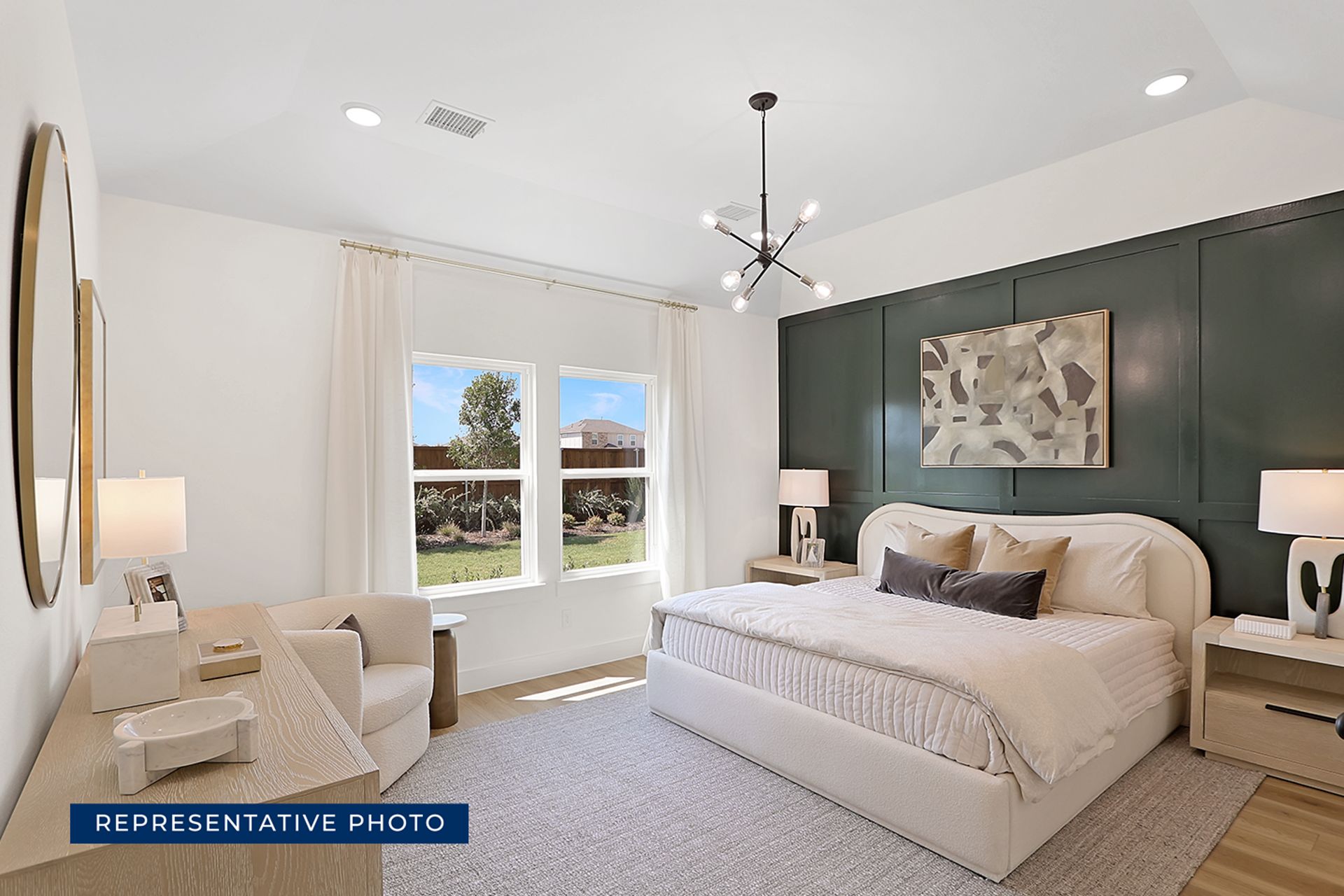Representative photo of modern bedroom with green accent wall and elegant decor.