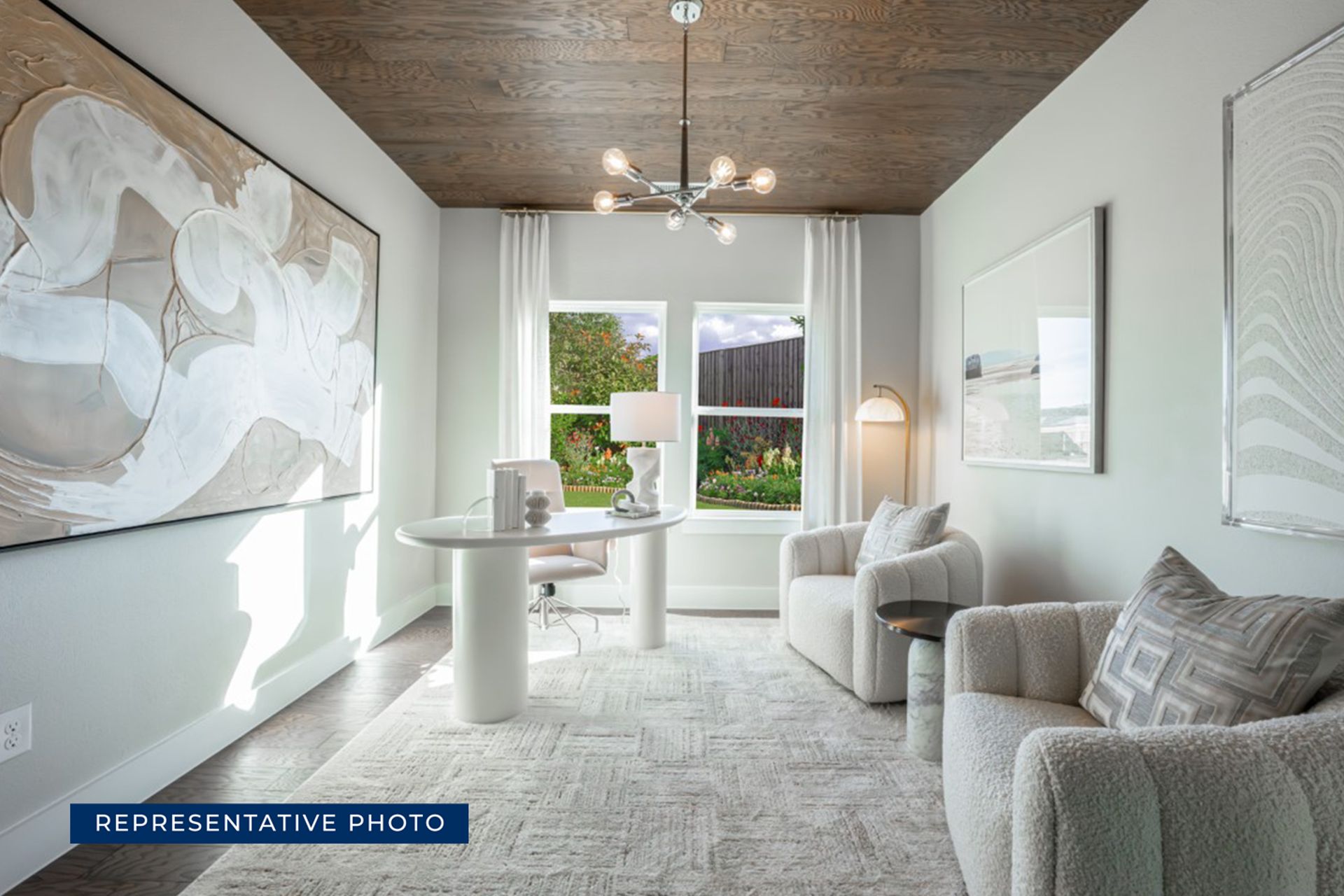 Bright modern office with abstract art and cozy seating.